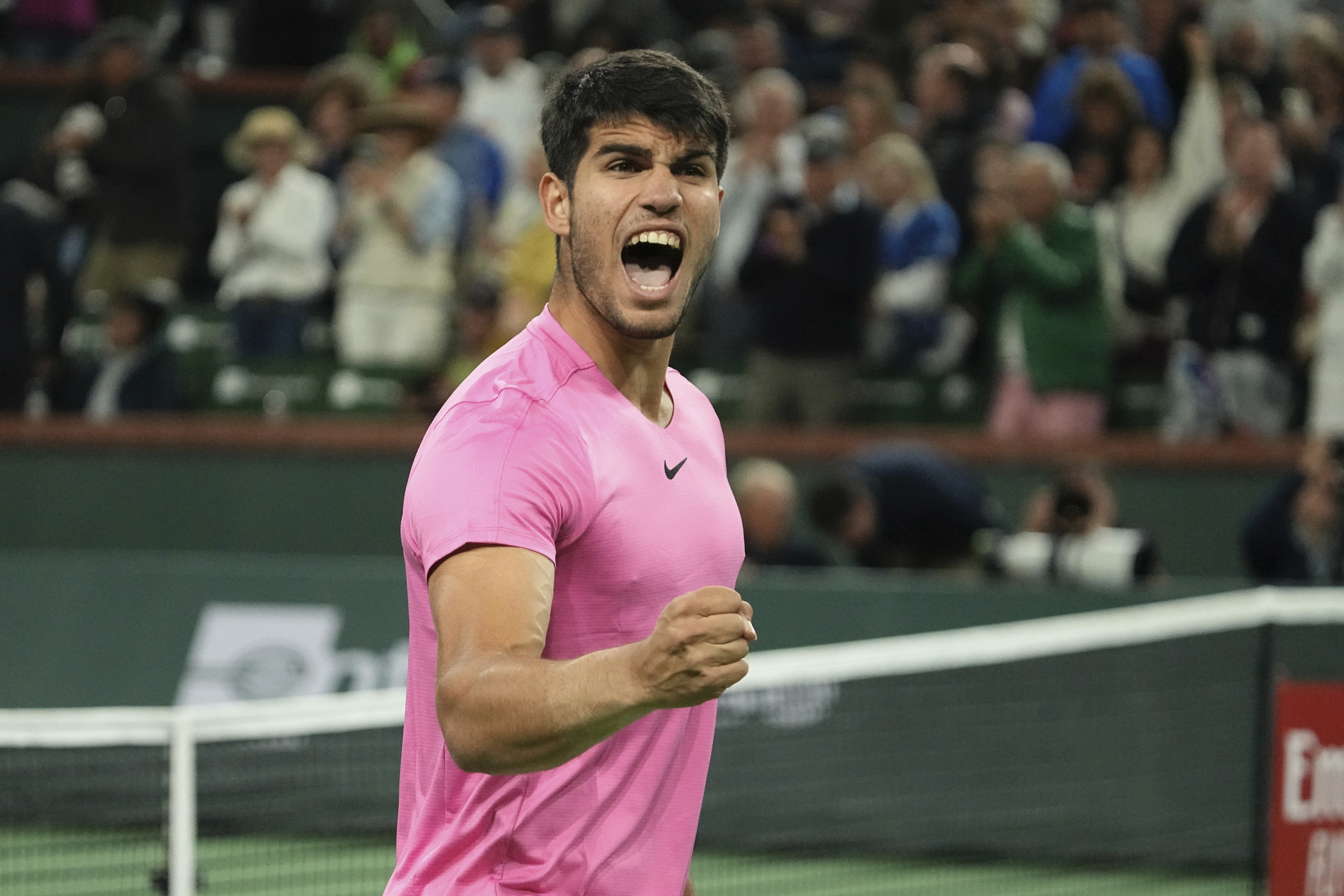 Carlos Alcaraz, of Spain, celebrates after winning his match over Felix Auger-Aliassime, of Canada, at the BNP Paribas Open tennis tournament Thursday, March 16, 2023, in Indian Wells, Calif. (AP Photo/Mark J. Terrill)