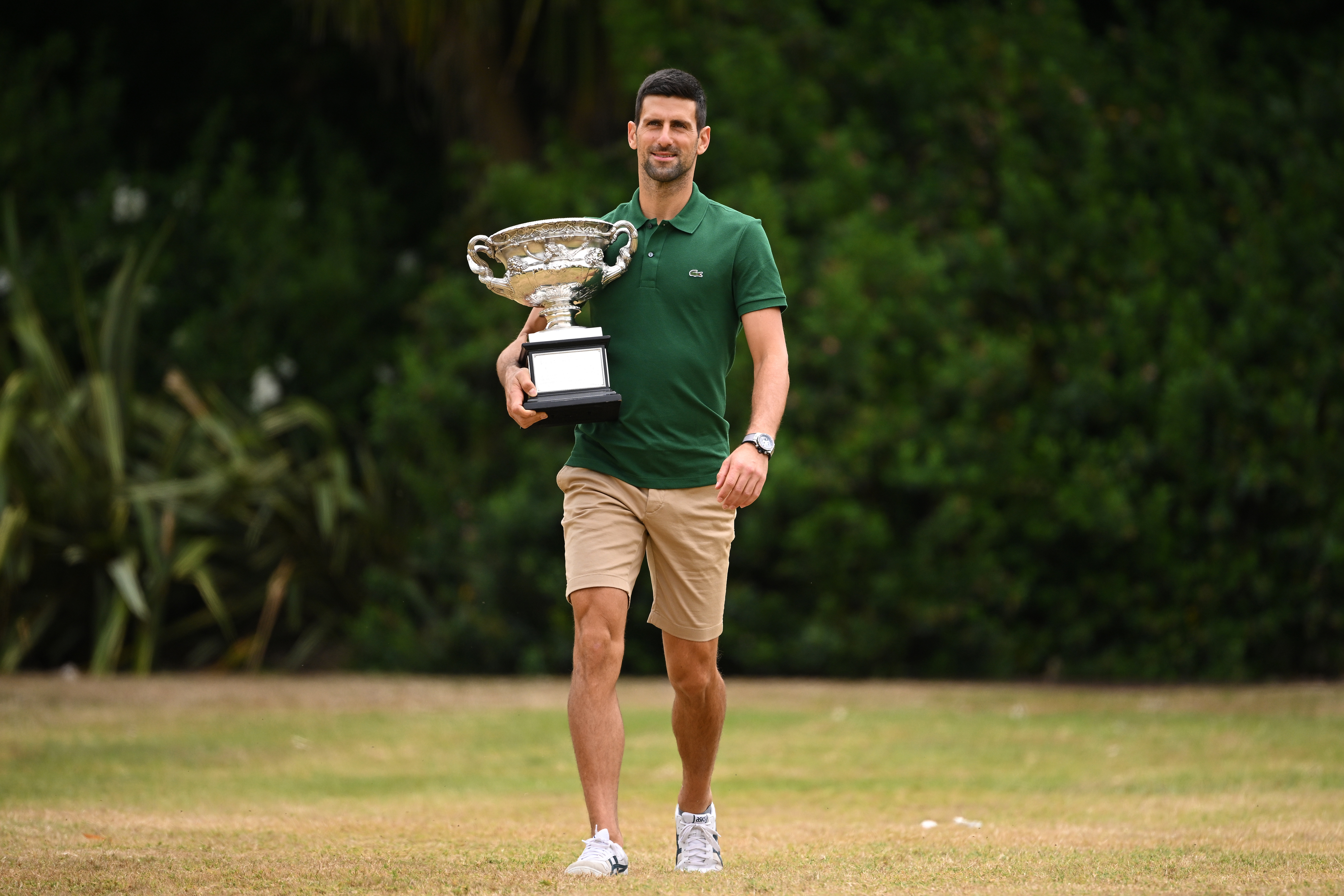 Djokovic poses with trophy after Australian Open win
