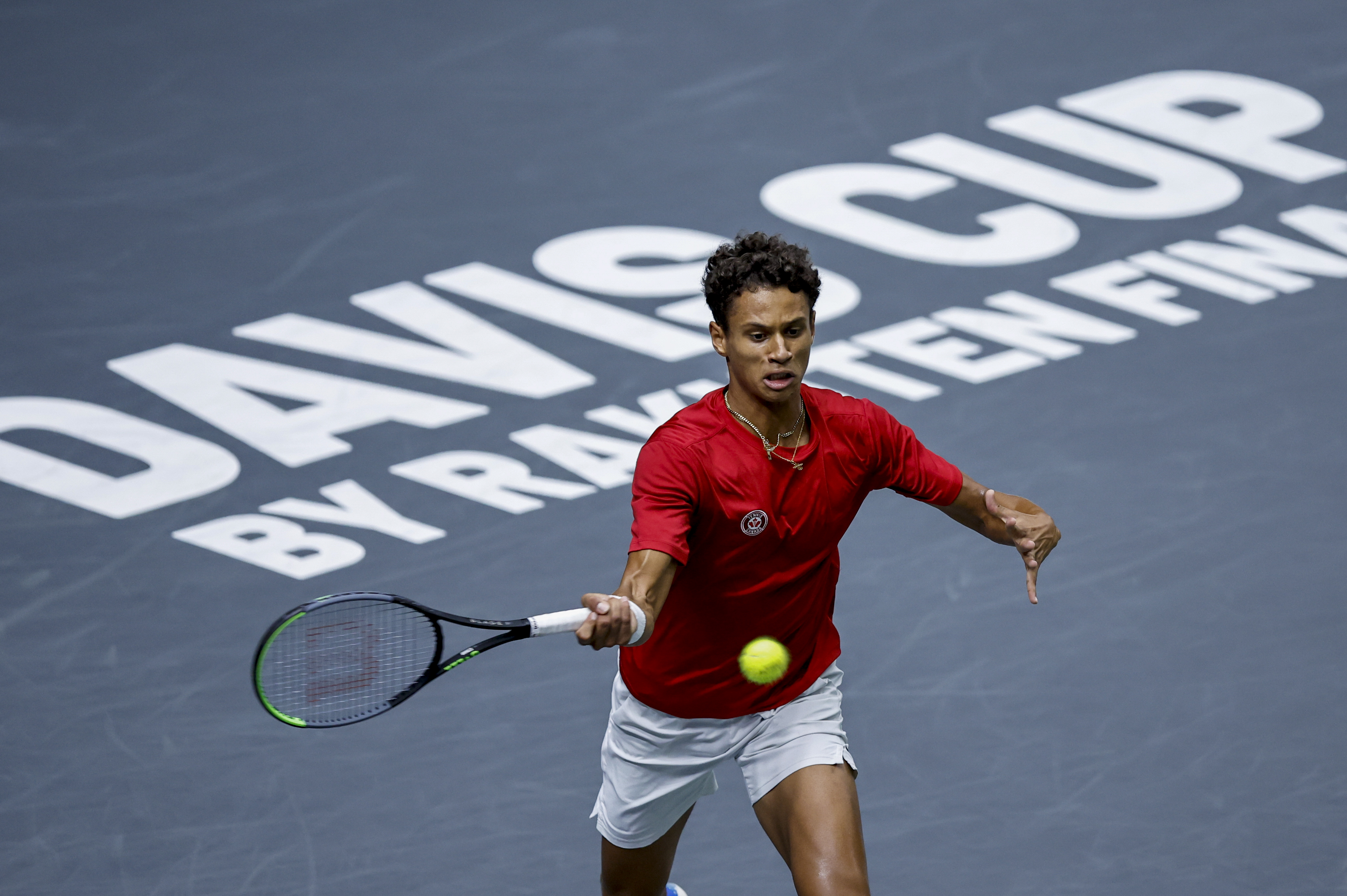 epa10190047 Canada's Gabriel Diallo in action against Serbia's Laslo Djere during their singles match of the Davis Cup Finals group B tie between Serbia and Canada in Valencia, eastern Spain, 17 September 2022.  EPA-EFE/Biel Alino