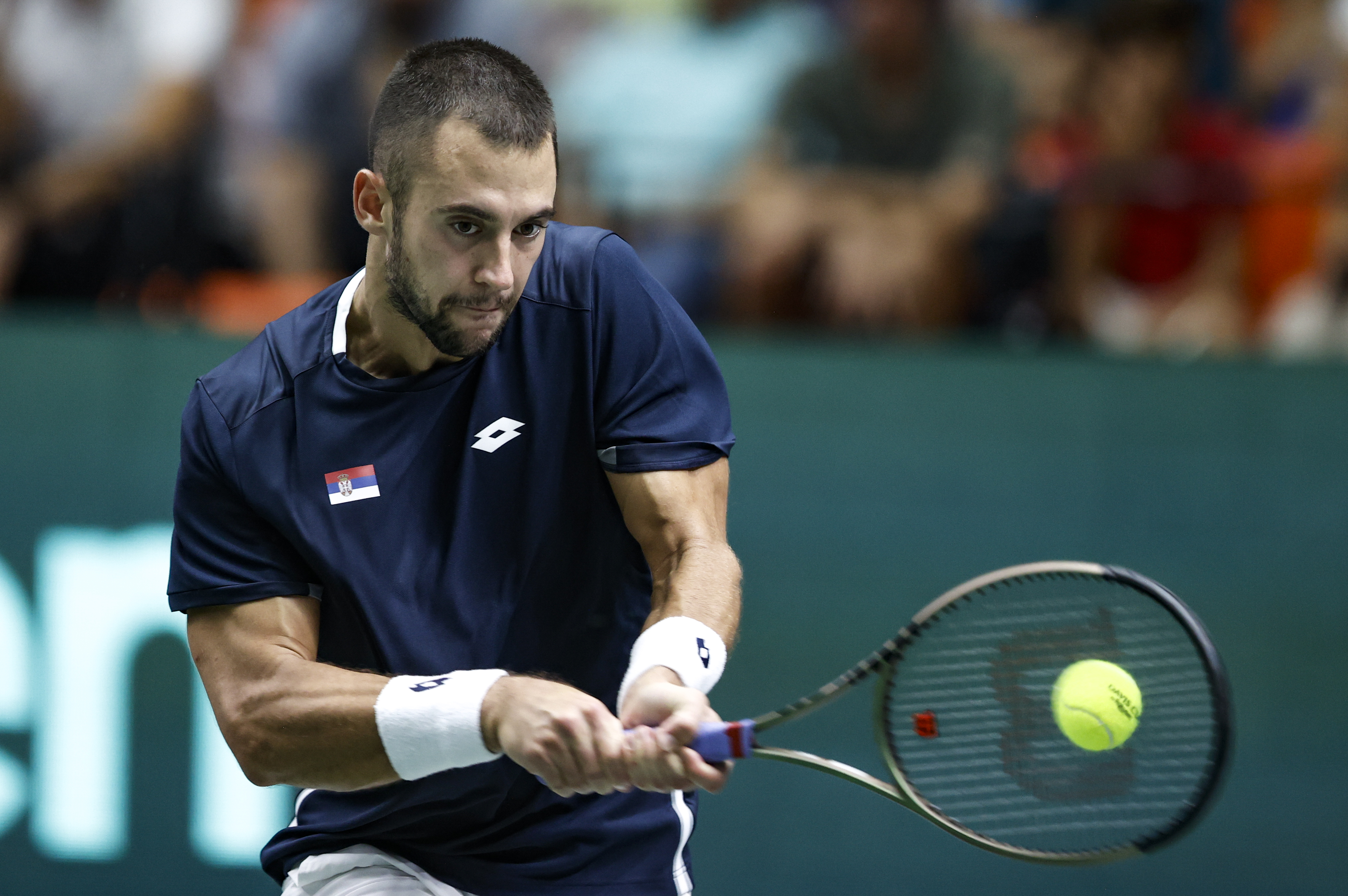epa10184109 Serbian tennis player Laslo Djere in action against Spanish Albert Ramos during the Davis Cup tennis match between Spain and Serbia, in Valencia, eastern Spain, 14 September 2022.  EPA-EFE/Kai Forsterling