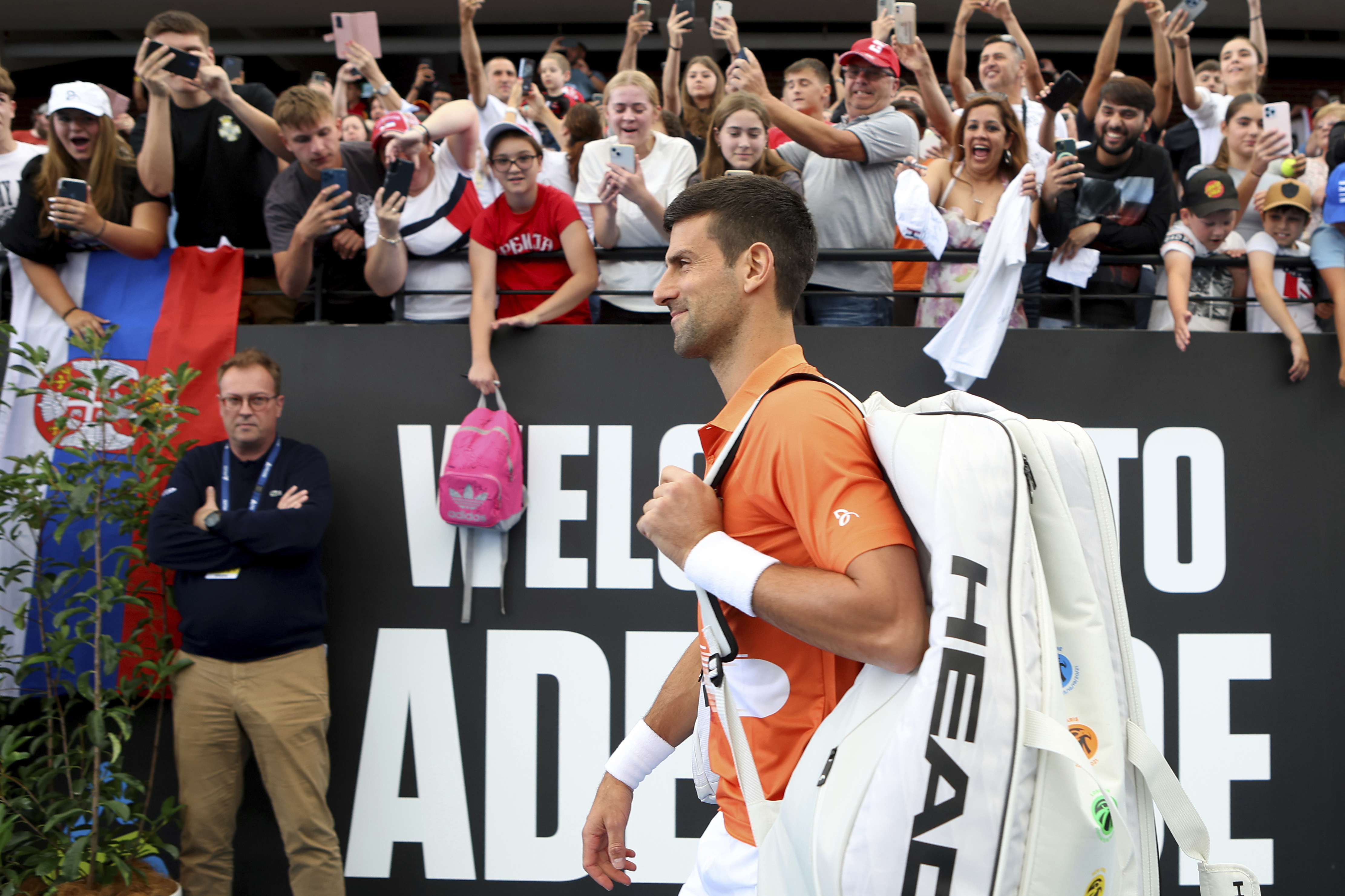 Serbia's Novak Djokovic walks on to center court for his round of 32 match against France's Constant Lestienne at the Adelaide International Tennis tournament in Adelaide, Australia, Tuesday, Jan. 3, 2023. (AP Photo/Kelly Barnes)