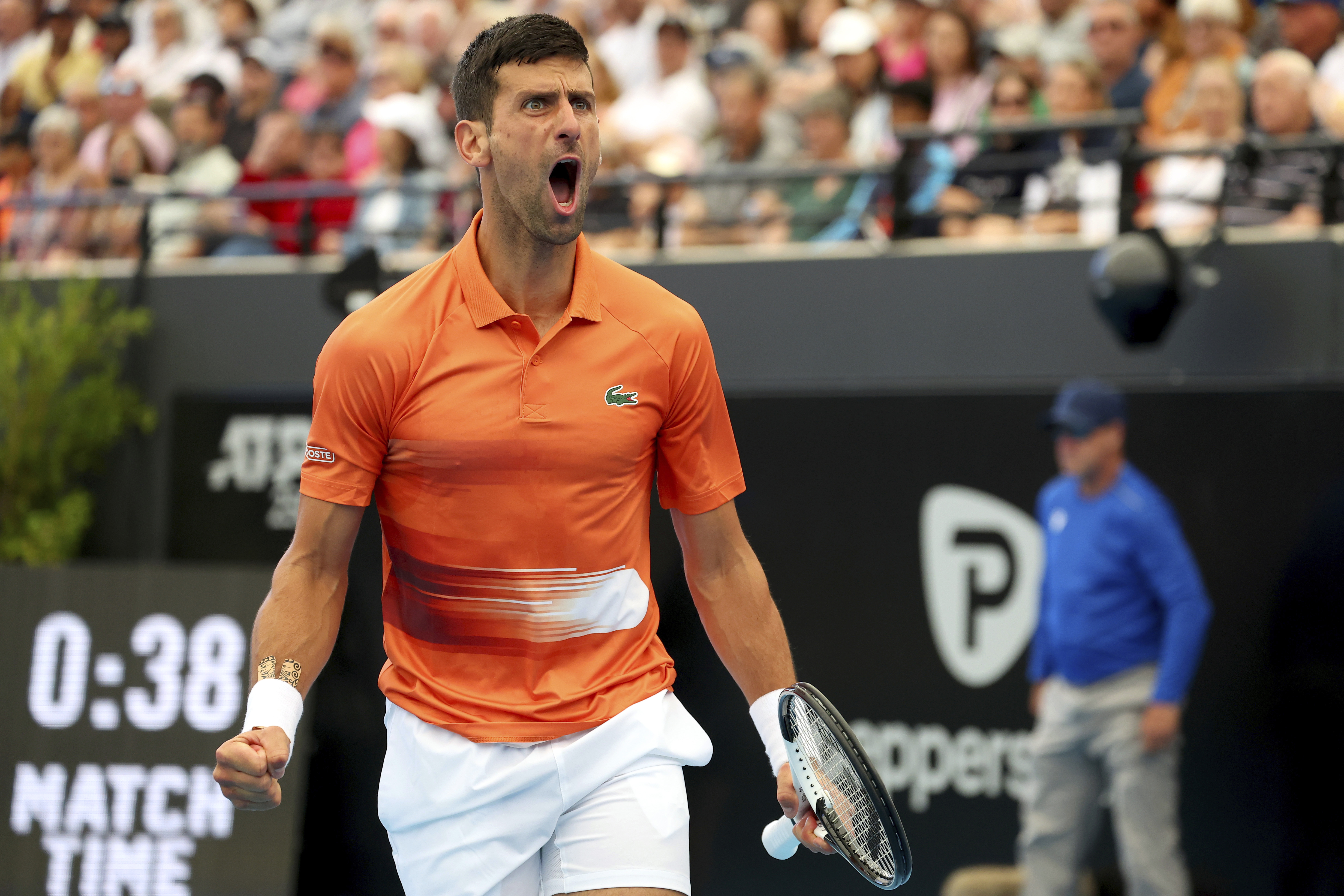Serbia's Novak Djokovic reacts after winning a break game against France's Quentin Halys during their Round of 16 match at the Adelaide International Tennis tournament in Adelaide, Australia, Thursday, Jan. 5, 2023. (AP Photo/Kelly Barnes)