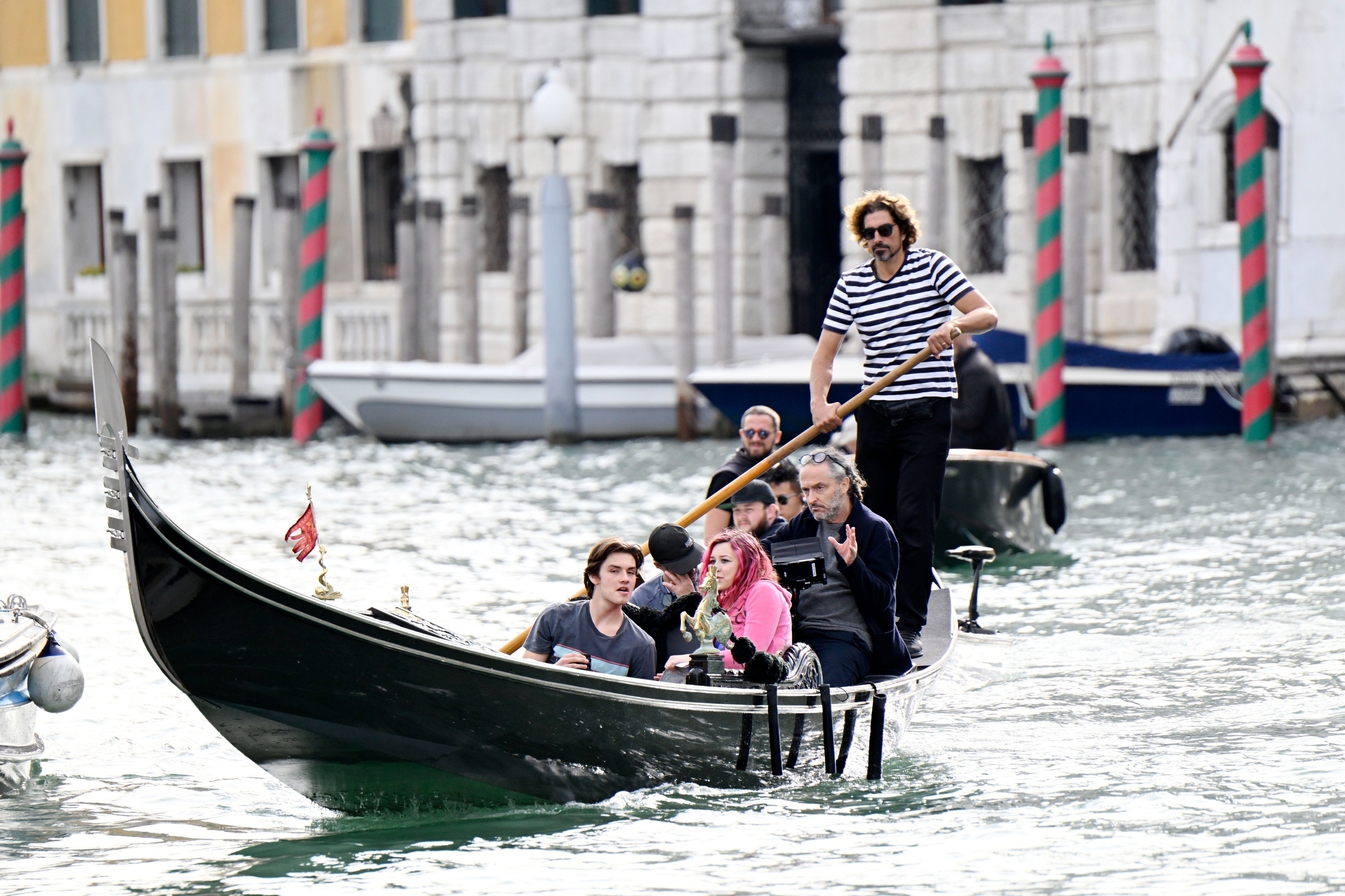 The English actor Louis Partridge and Liv Hill in Venice on the set set Apple Tv production on gondola innCanal Grande in Venice
