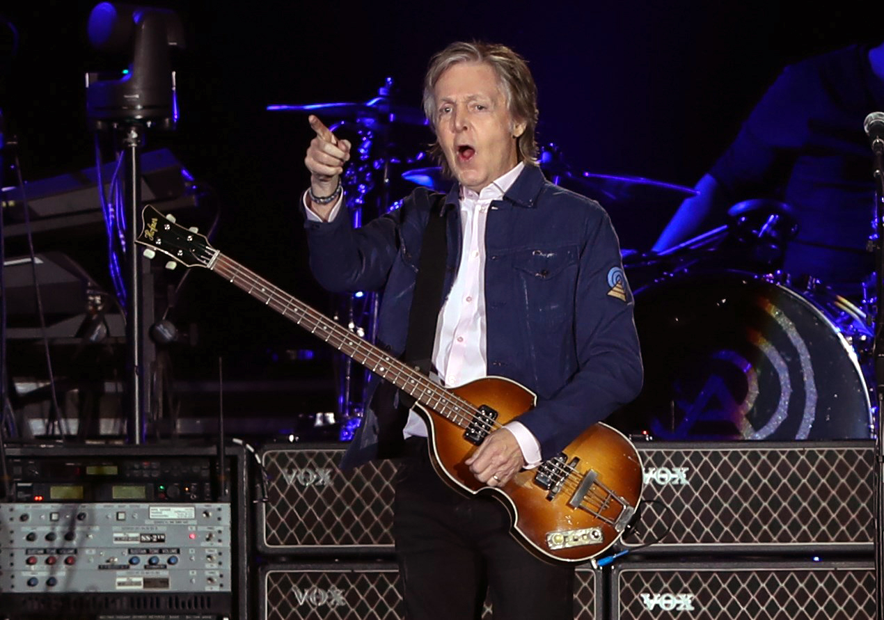 epa07452001 The Beatles' former bass players Paul McCartney (C) performs in Santiago, Chile, 20 March 2019.  EPA-EFE/ALBERTO VALDES