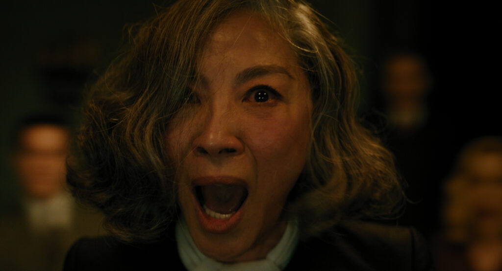 Michelle Yeoh as Mrs. Reynolds in 20th Century Studios' A HAUNTING IN VENICE. Photo courtesy of 20th Century Studios. © 2023 20th Century Studios. All Rights Reserved.