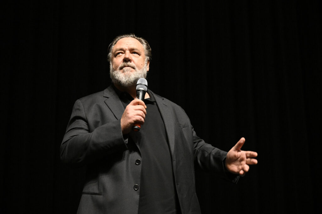 Australian actor Russell Crowe speaks to the audience prior the screening of 'Master and Commander: The Far Side of the World' at the 57th Karlovy Vary International Film Festival on July 1, 2023. (Katerina Sulova/CTK via AP)