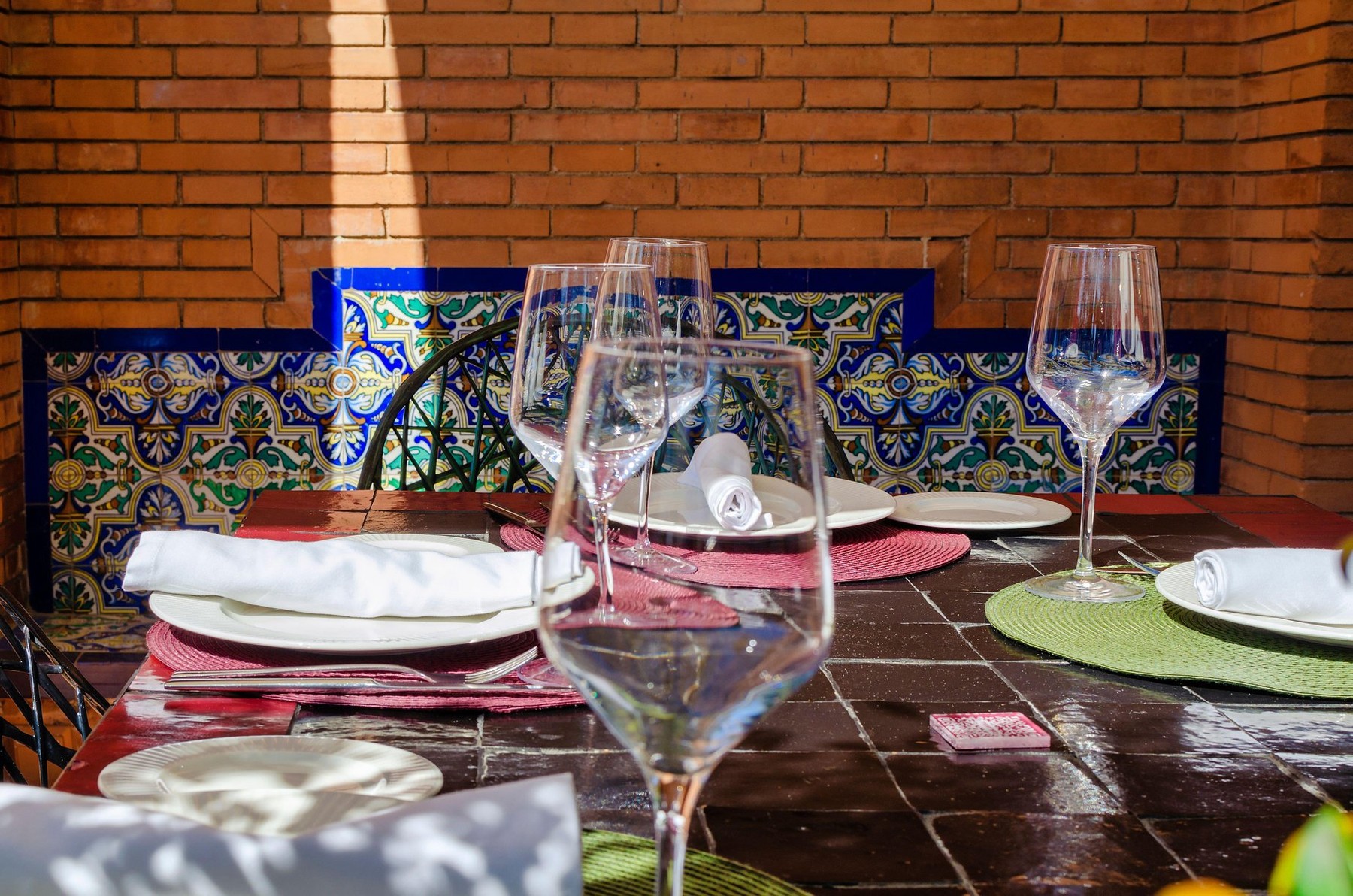 Served table set at summer terrace restaurant in Seville, Spain
