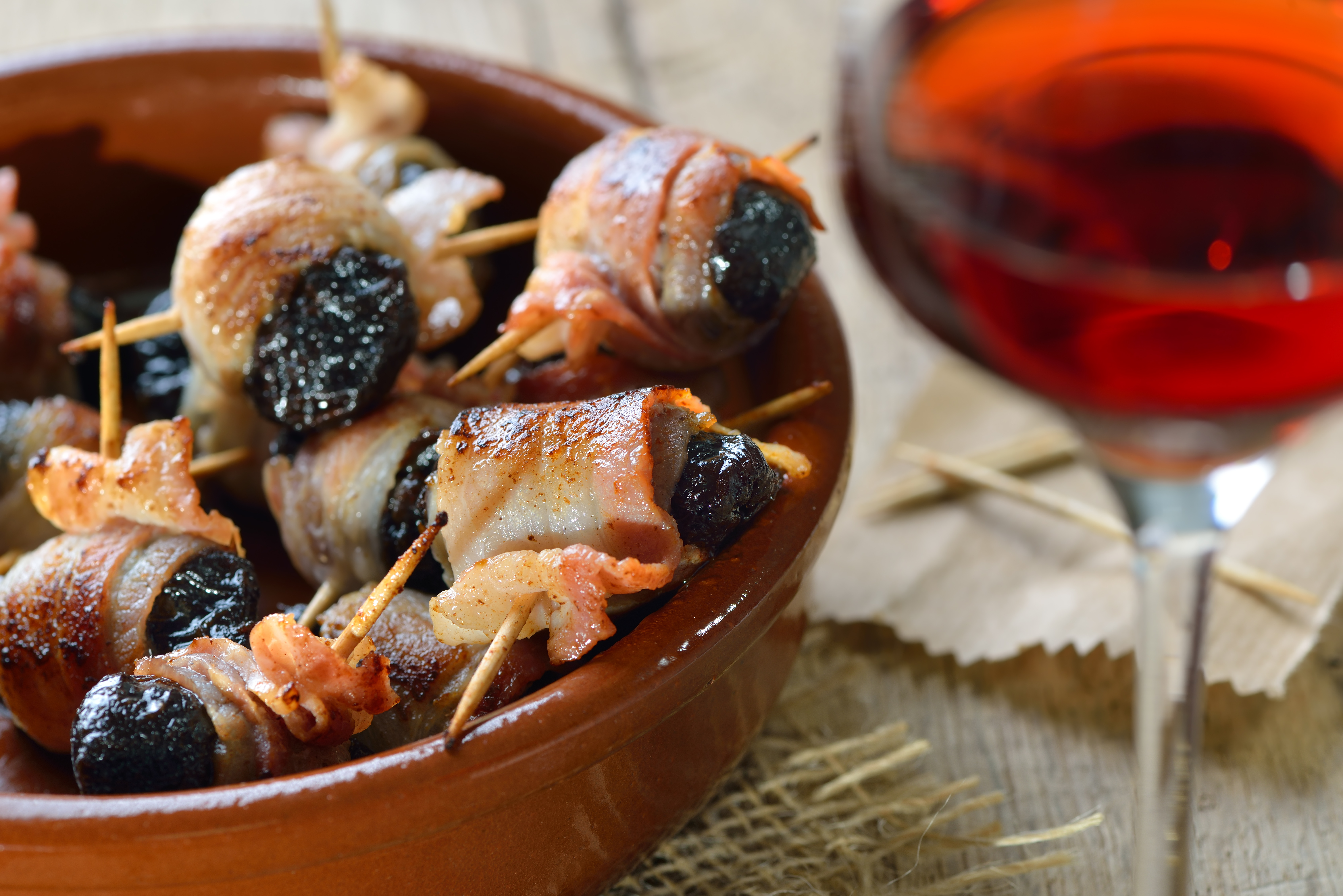 Delicious,Spanish,Tapas:,Fried,Prunes,Wrapped,In,Bacon,Served,With