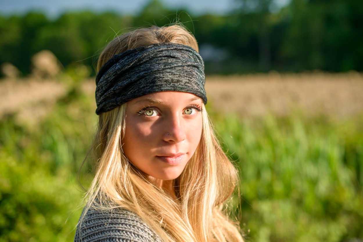 Portrait of pretty young woman with green eyes wearing bandana