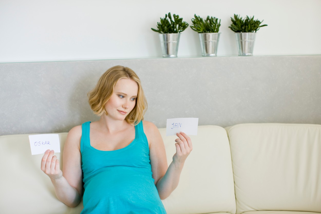 pregnant woman choosing name for baby