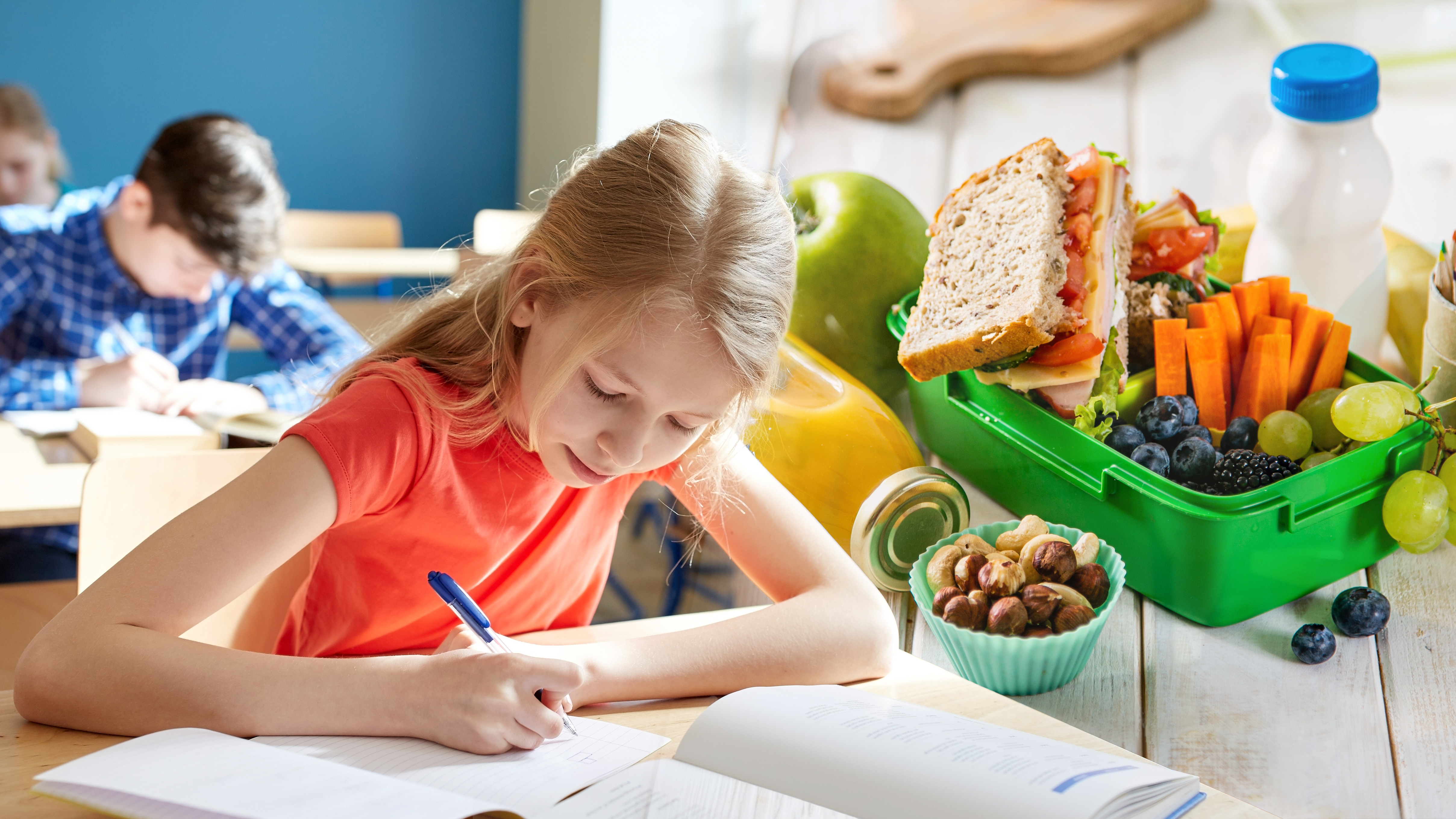 education, learning and people concept - student girl with book writing school test
