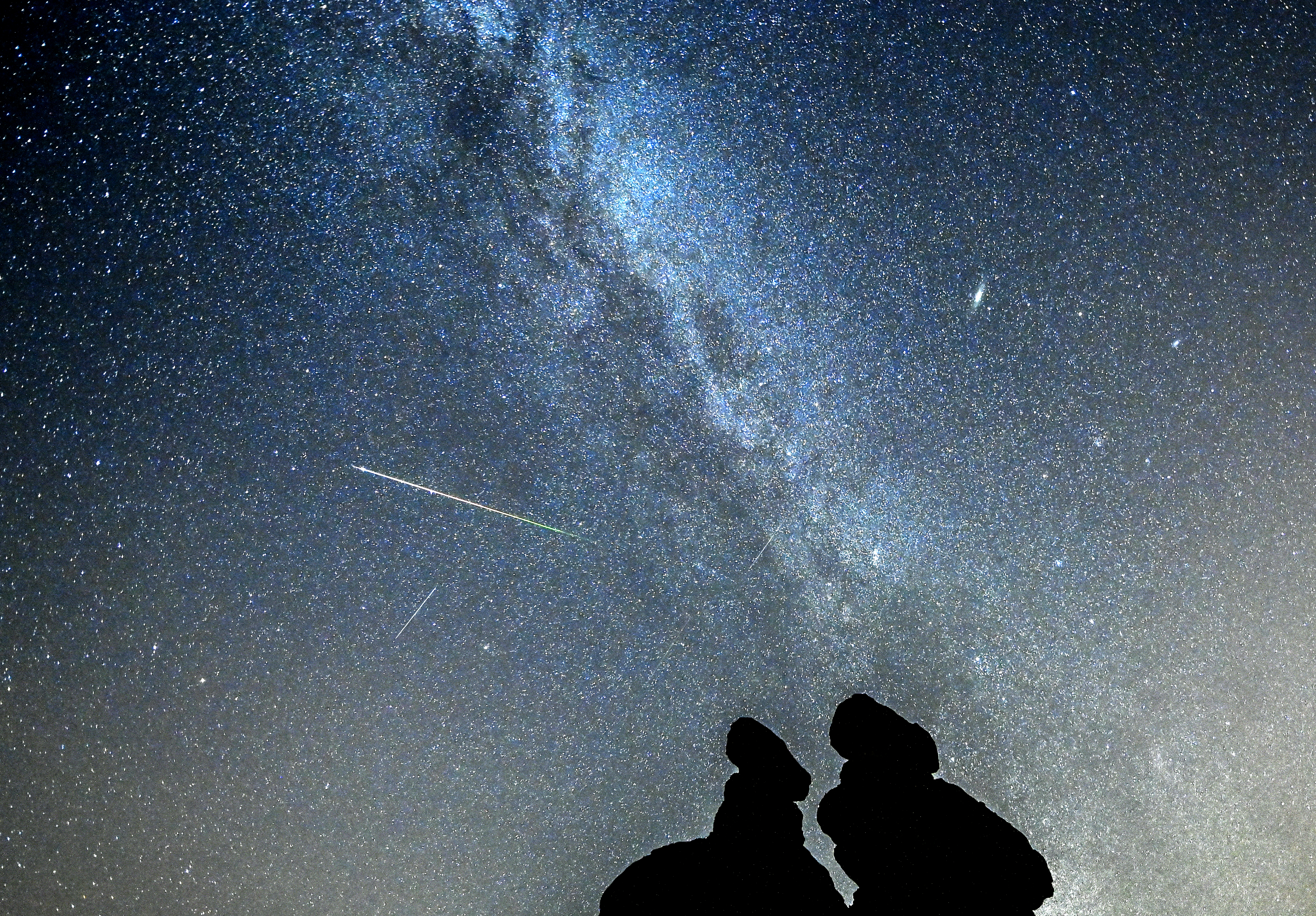 Perseid meteor shower over the stone dools in Kuklice