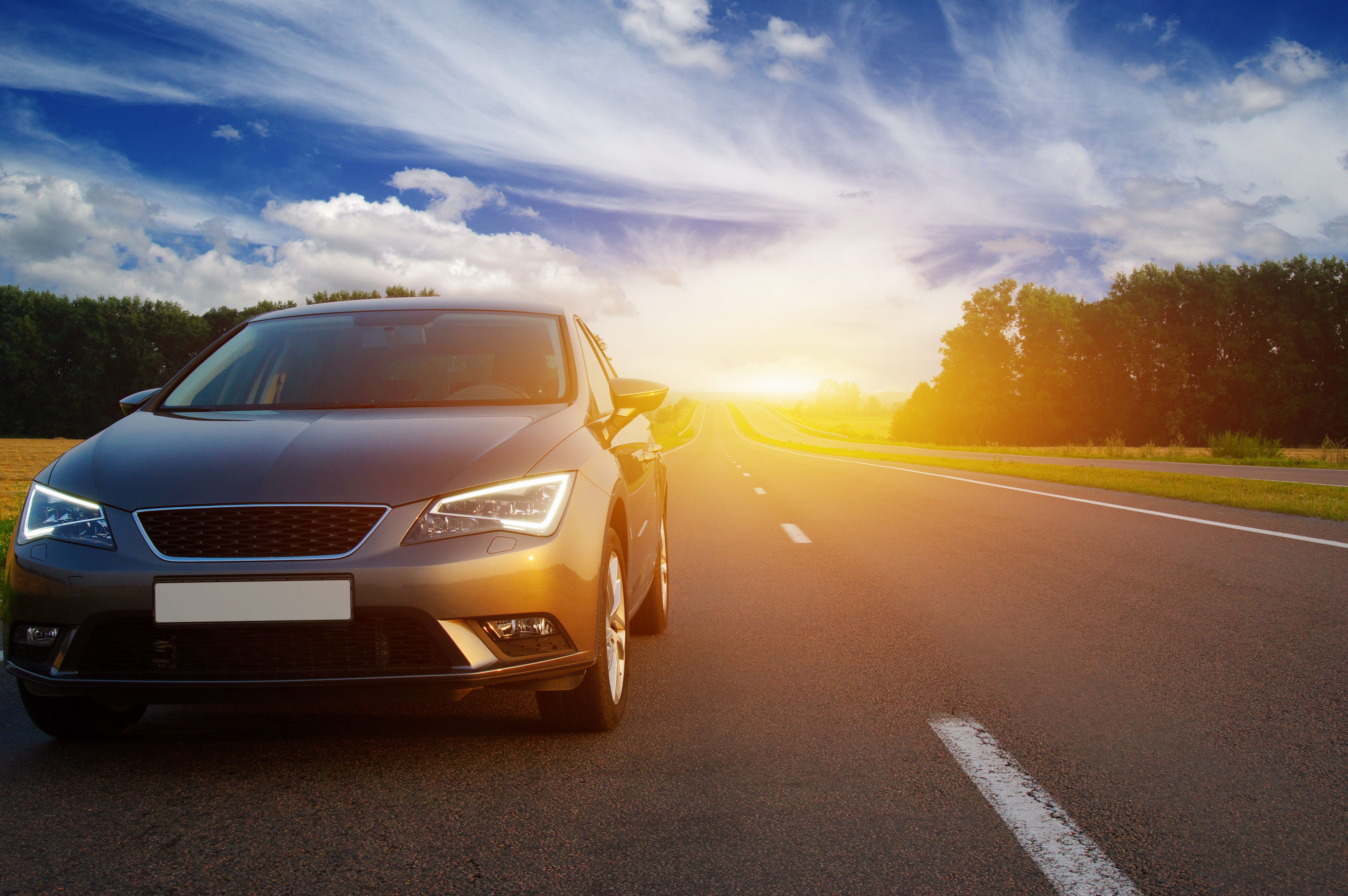 Car,On,Asphalt,Road,In,Summer