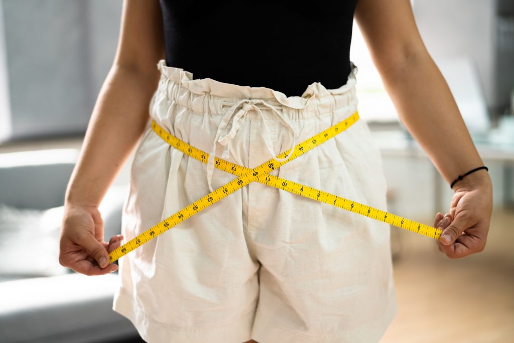 Weight Loss Measure. Losing Belly Fat After Training,Image: 625200272, License: Royalty-free, Restrictions: , Model Release: yes, Credit line: Andriy Popov / Panthermedia / Profimedia