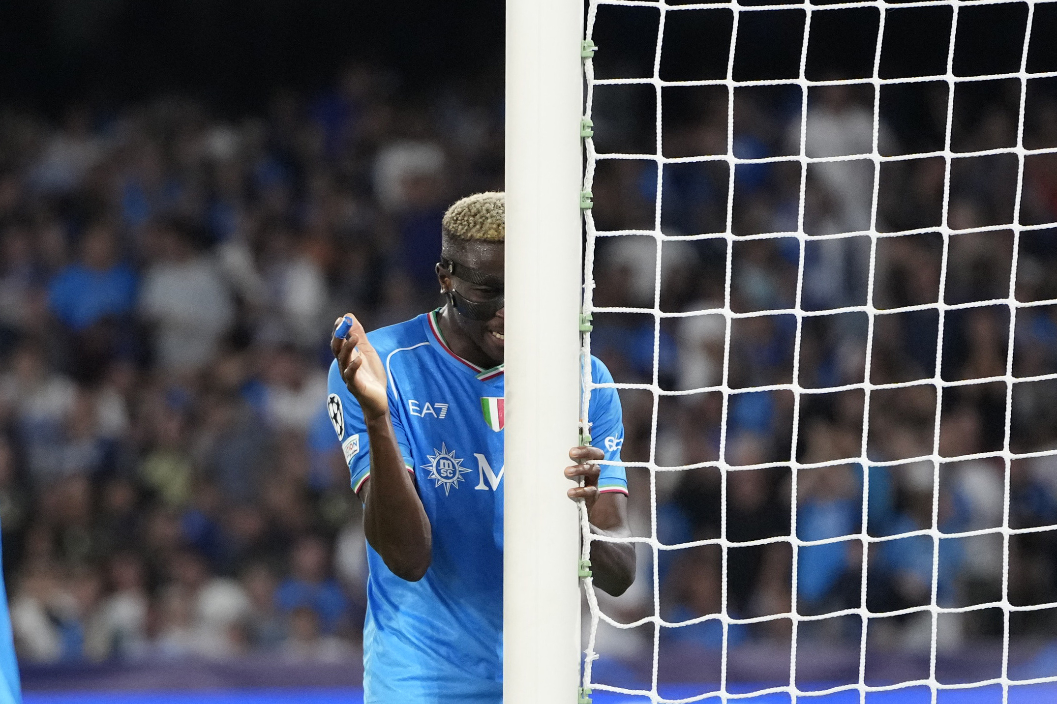 Napoli's Victor Osimhen reacts after missing a chance to score during the Champions League group C soccer match between Napoli and Real Madrid at the Diego Armando Maradona stadium in Naples, Italy, Tuesday, Oct. 3, 2023. (AP Photo/Alessandra Tarantino)