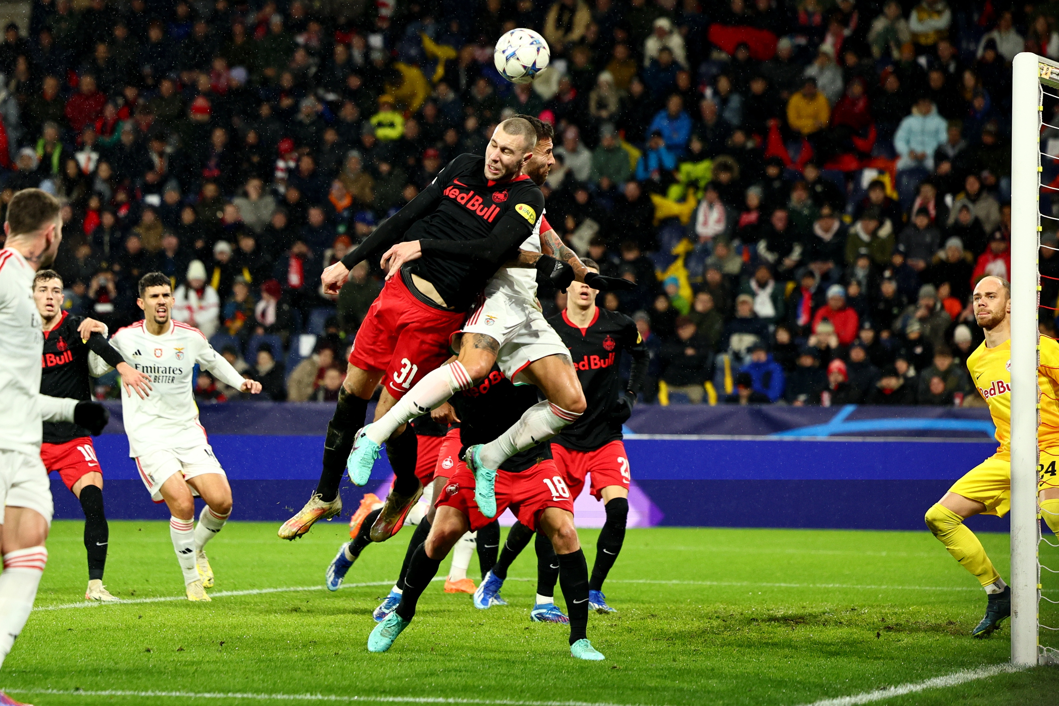 epa11025339 Salzburg's Strahinja Pavlovic (L) in action against Benfica's Nicolas Otamendi (R) during the UEFA Champions League group stage match between RB Salzburg and Benfica Lisbon in Salzburg, Austria, 12 December 2023.  EPA-EFE/ANNA SZILAGYI