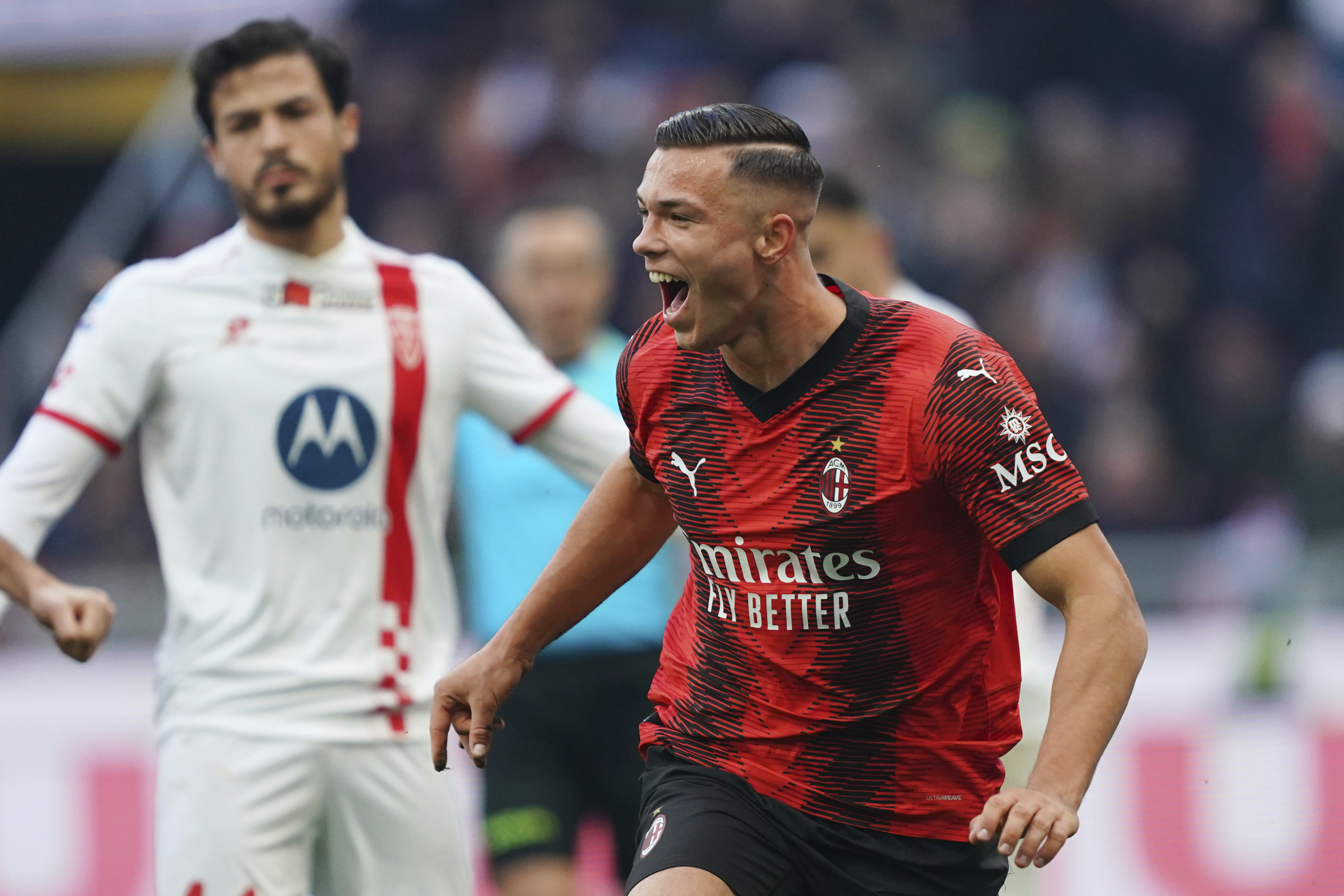 Milan's Jan Carlo Simic, right, celebrates after scoring their side's second goal of the game during the Serie A soccer match between AC Milan and AC Monza at San Siro stadium in Milan, Italy, Sunday Dec. 17, 2023. (Spada/LaPresse via AP)