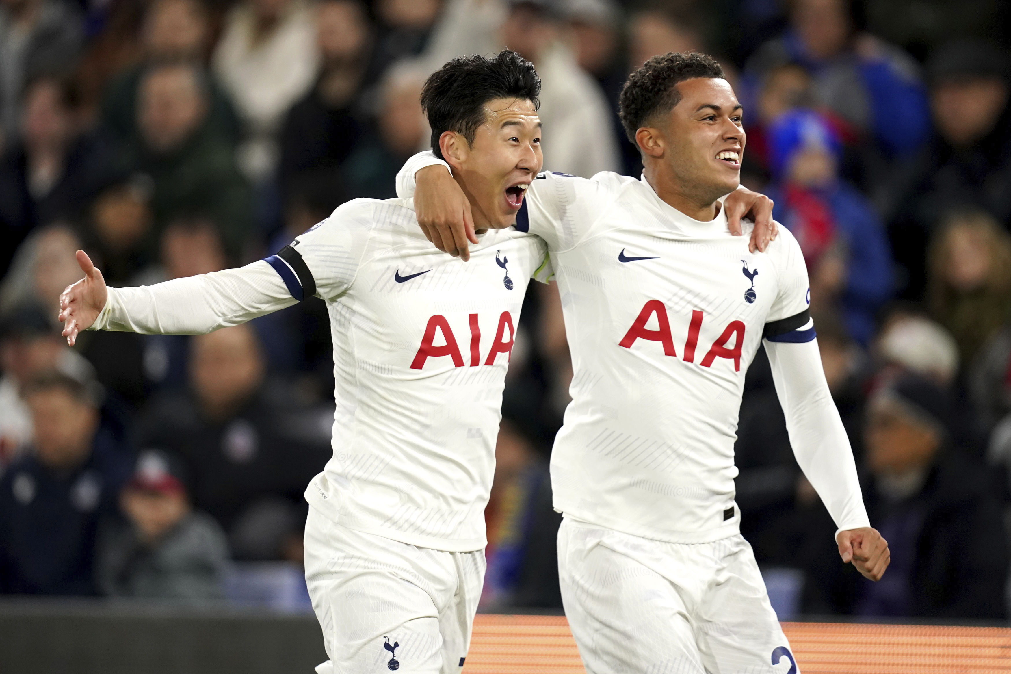 Tottenham Hotspur's Heung-Min Son, left, celebrates after scoring with teammate Brennan Johnson during the English Premier League soccer match against Crystal Palace at Selhurst Park, London, Friday Oct. 27, 2023. (John Walton/PA via AP)
