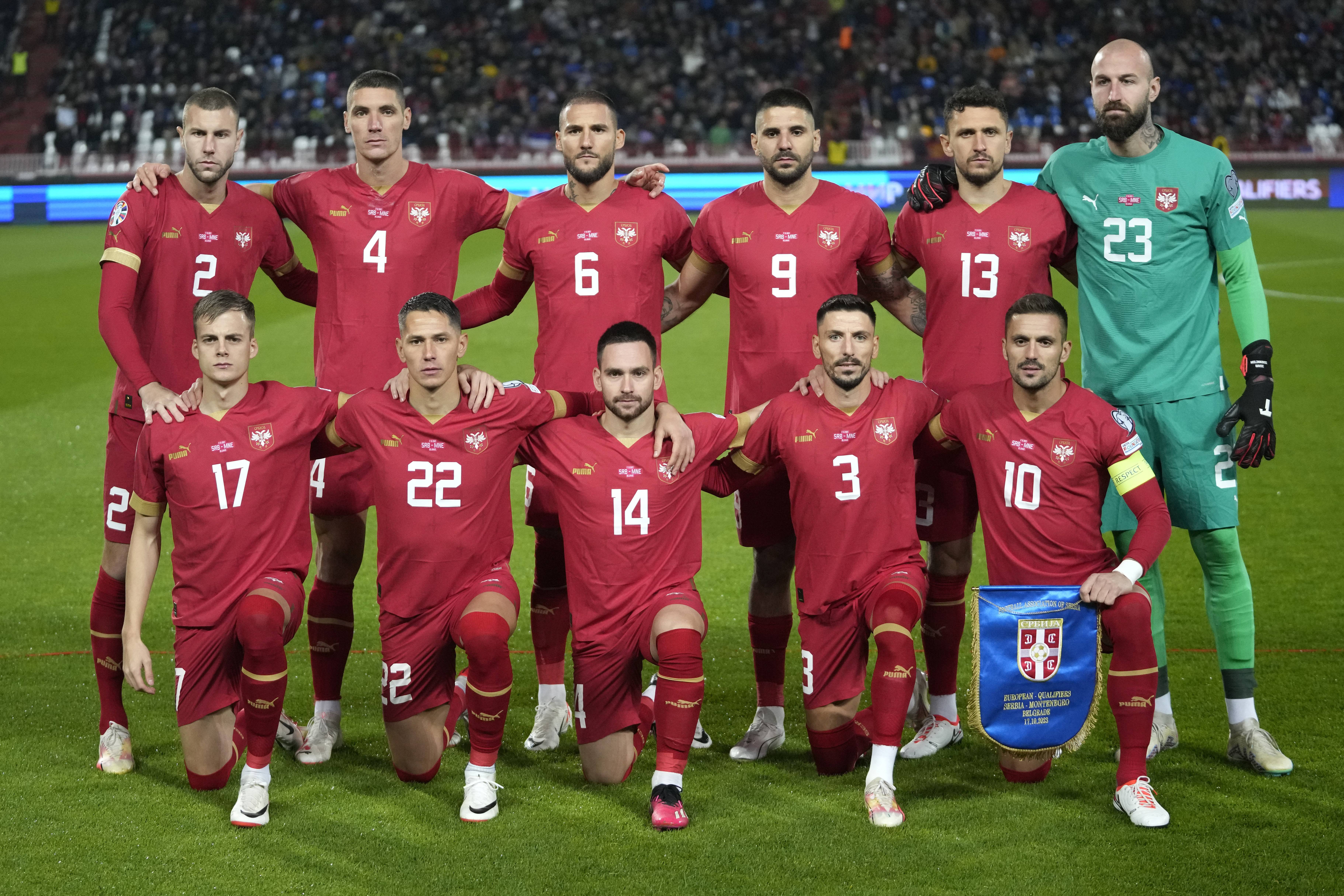 Players of Serbia line up for the Euro 2024 group G qualifying soccer match between Serbia and Montenegro, at the Rajko Mitic Stadium in Belgrade, Serbia, Tuesday, Oct. 17, 2023. (AP Photo/Darko Vojinovic)