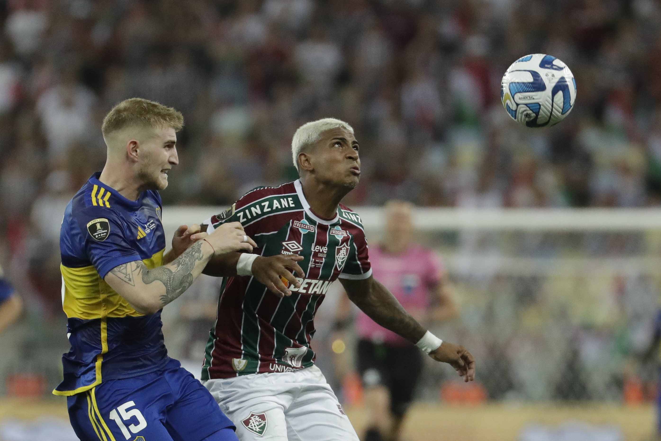 John Kennedy of Brazil's Fluminense, right, and Nicolas Valentini of Argentina's Boca Juniors battle for the ball during a Copa Libertadores final soccer match at Maracana stadium in Rio de Janeiro, Brazil, Saturday, Nov. 4, 2023. (AP Photo/Bruna Prado)