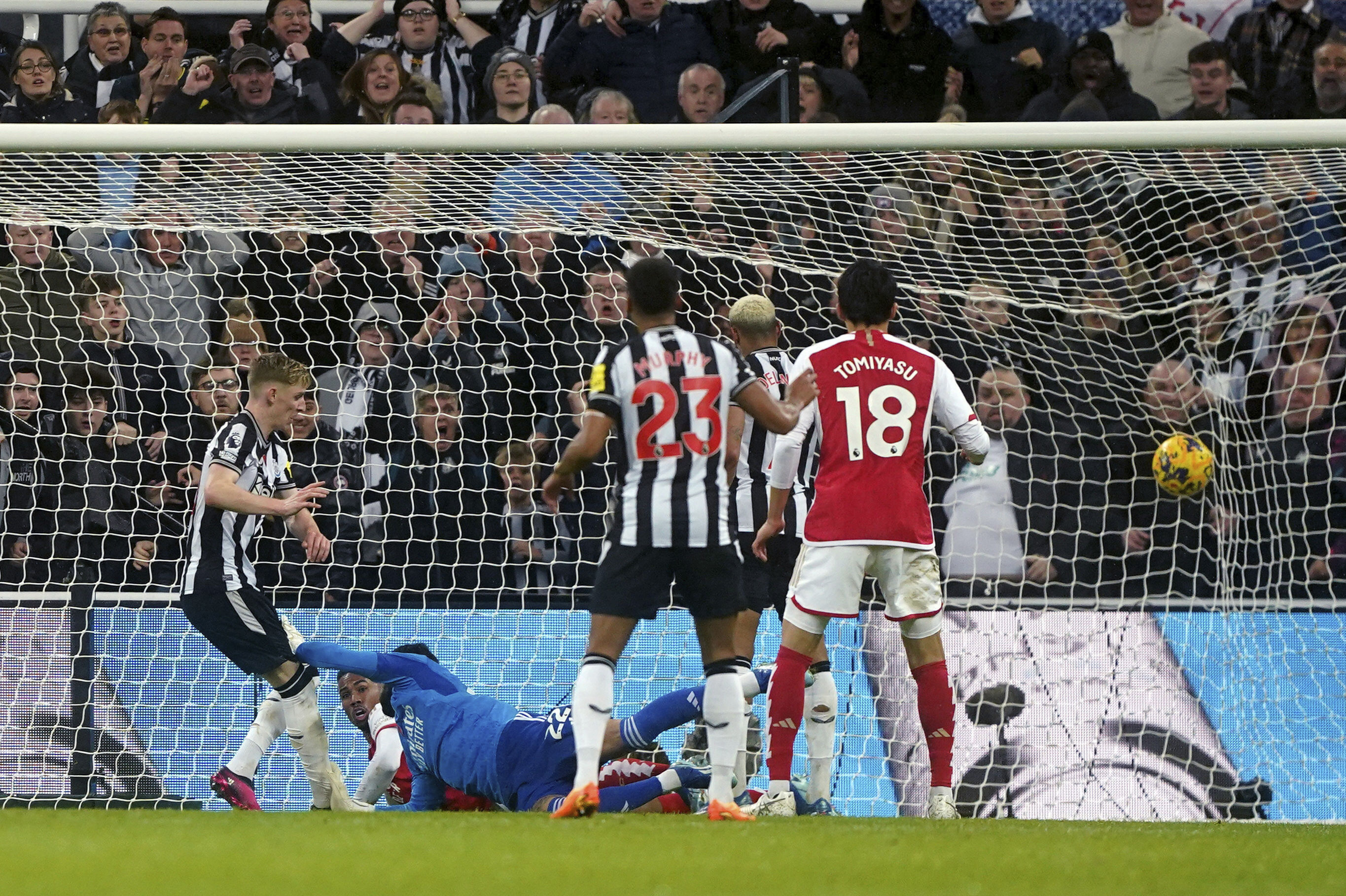 Newcastle United's Anthony Gordon scores his side's first goal , during the English Premier League soccer match between Newcastle United and Arsenal at St. James' Park, in Newcastle upon Tyne, England, Saturday, Nov. 4, 2023. (Owen Humphreys/PA via AP)
