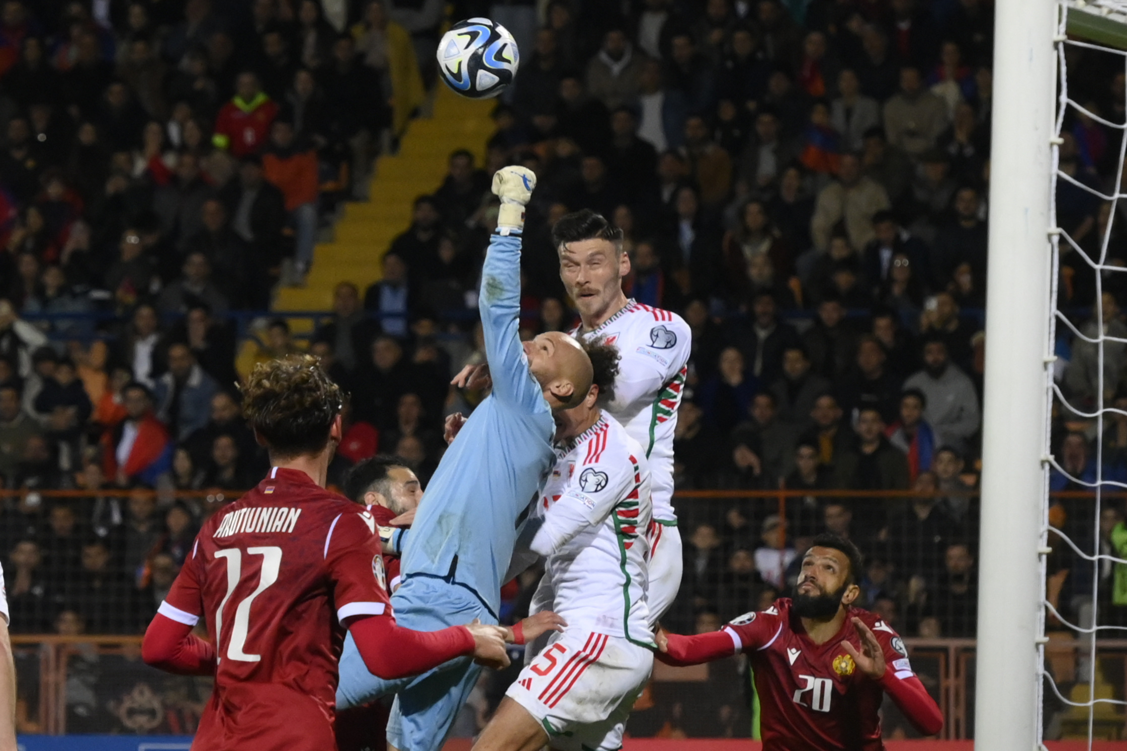 Armenia's goalkeeper Ognjen Chancharevich makes a save during the Euro 2024 group D qualifying soccer match between Armenia and Wales at the Vazgen Sargsyan Republican Stadium in Yerevan, Armenia, Saturday, Nov. 18, 2023. (AP Photo/Hakob Berberyan)