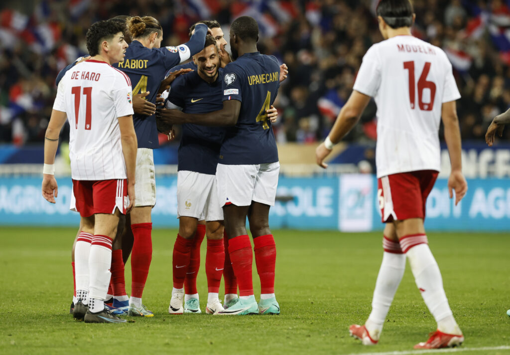 epa10983480 Jonathan Clauss (C) of France is celebrated by teammates after scoring the 5-0 goal during the UEFA EURO 2024 Group B qualification match between France and Gibraltar in Nice, France, 18 November 2023.  EPA-EFE/SEBASTIEN NOGIER