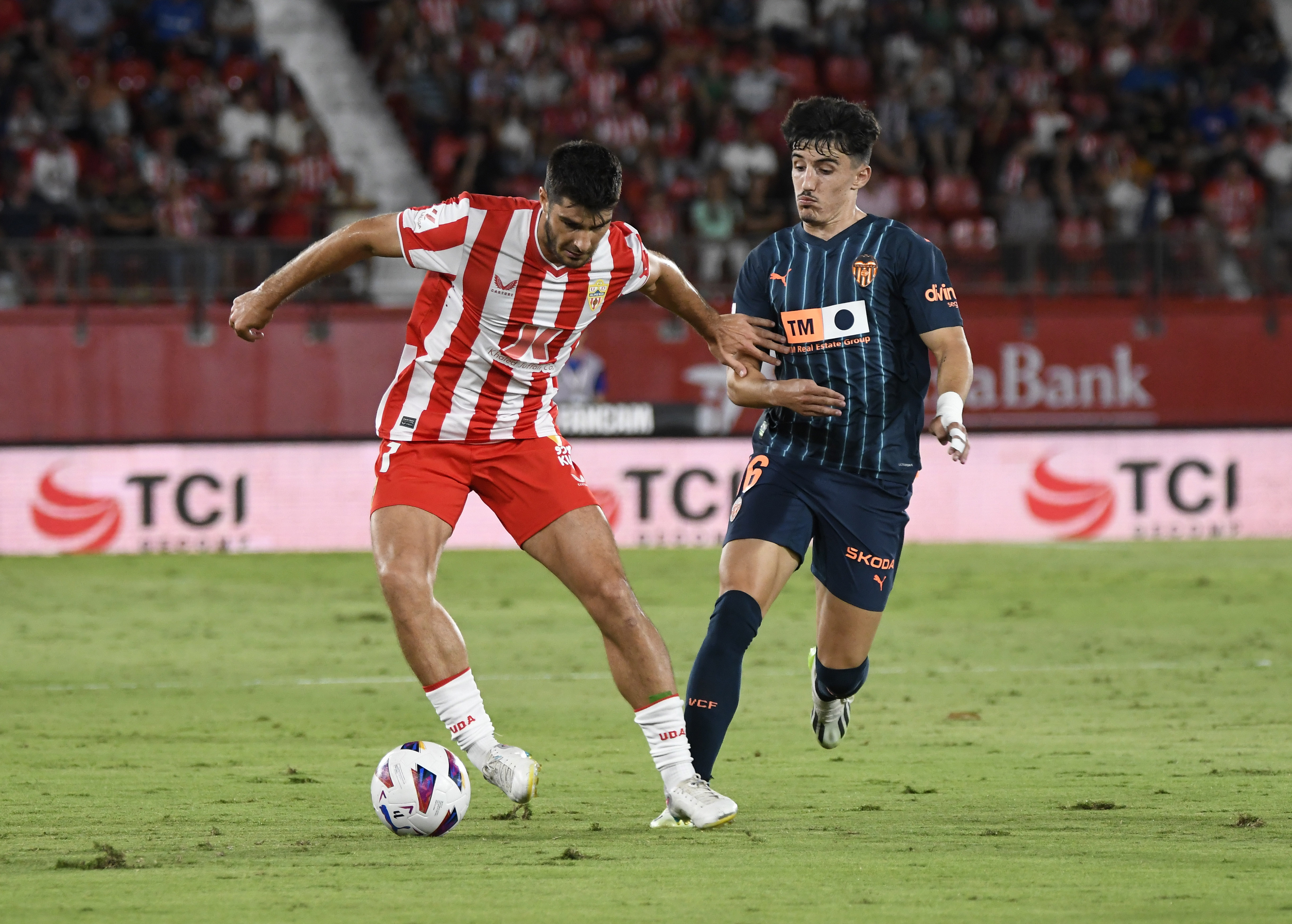 epa10879547 Valencia's striker Diego Lopez (R) in action against Almeria's midfielder Gonzalo Melero (L) during the Spanish LaLiga soccer match between UD Almeria and Valencia CF, in Almeria, Spain, 23 September 2023.  EPA-EFE/Carlos Barba