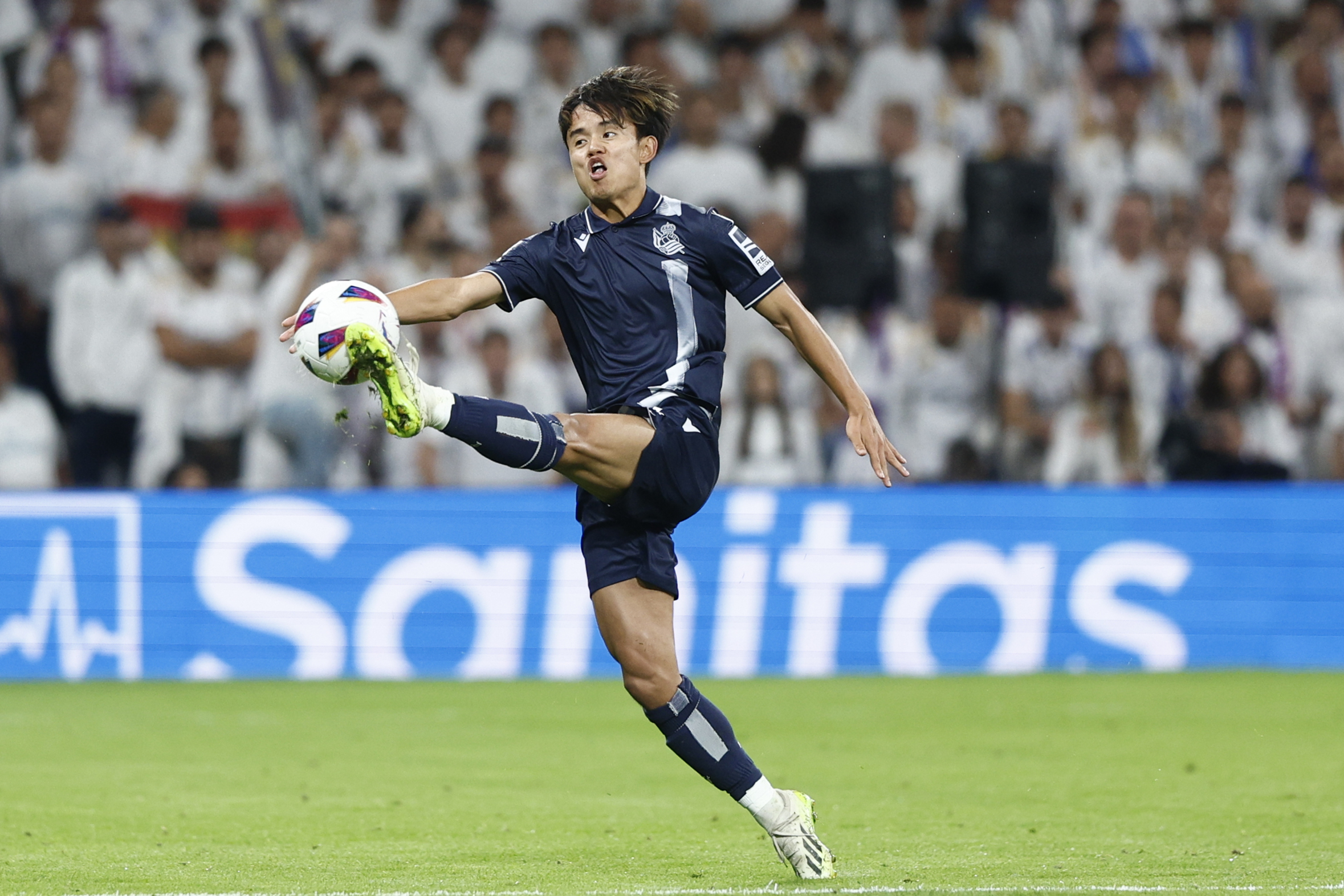 epa10867137 Real Sociedad's striker Take Kubo in action during the Spanish LaLiga soccer match between Real Madrid and Real Sociedad, in Madrid, Spain, 17 September 2023.  EPA-EFE/Rodrigo Jimenez