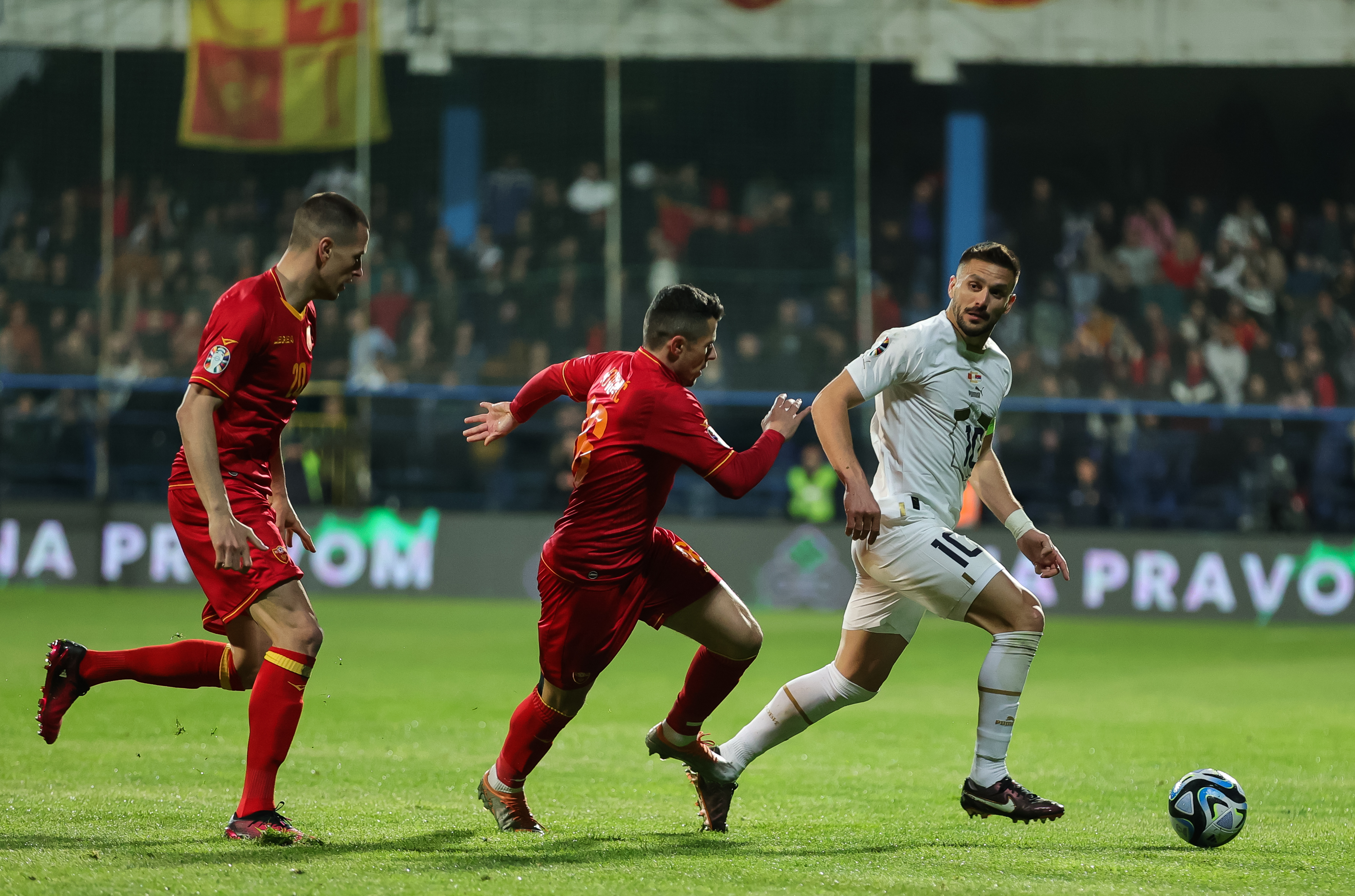 Dusan Tadic (R) Vladimir Jovovic (C) and Adam Marusic during the  UEFA EURO 2024 Qualifiers Group G match between Montenegro and Serbia at  City Stadium on March 27, 2023 in Podgorica, Montenegro. (Photo by Srdjan Stevanovic/Starsport.rs ©)