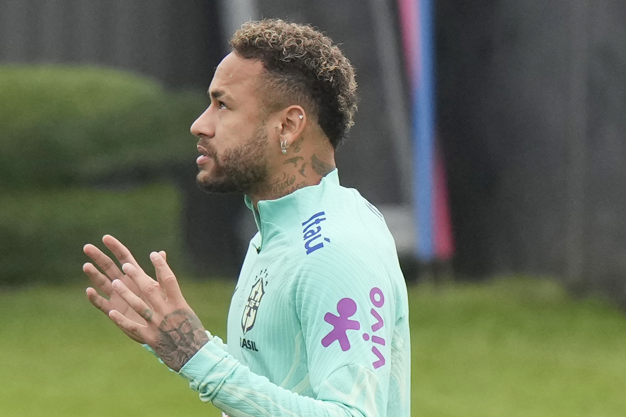 Brazil's Neymar gestures as he enters the field during a training session at the Continassa sporting center, in Turin, Italy, Thursday, Nov. 17, 2022. Brazil will compete in Group G at the 2022 FIFA World Cup. (AP Photo/Luca Bruno)