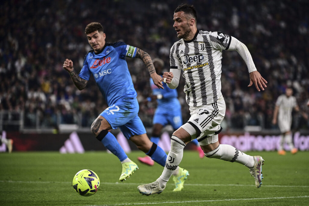 Juventus' Filip Kostic, right, and Napoli's Giovanni Di Lorenzo during the Italian Serie A soccer match between Juventus and Napoli at the Allianz stadium in Turin, Italy, Sunday April 23, 2023. (Marco Alpozzi/LaPresse via AP)