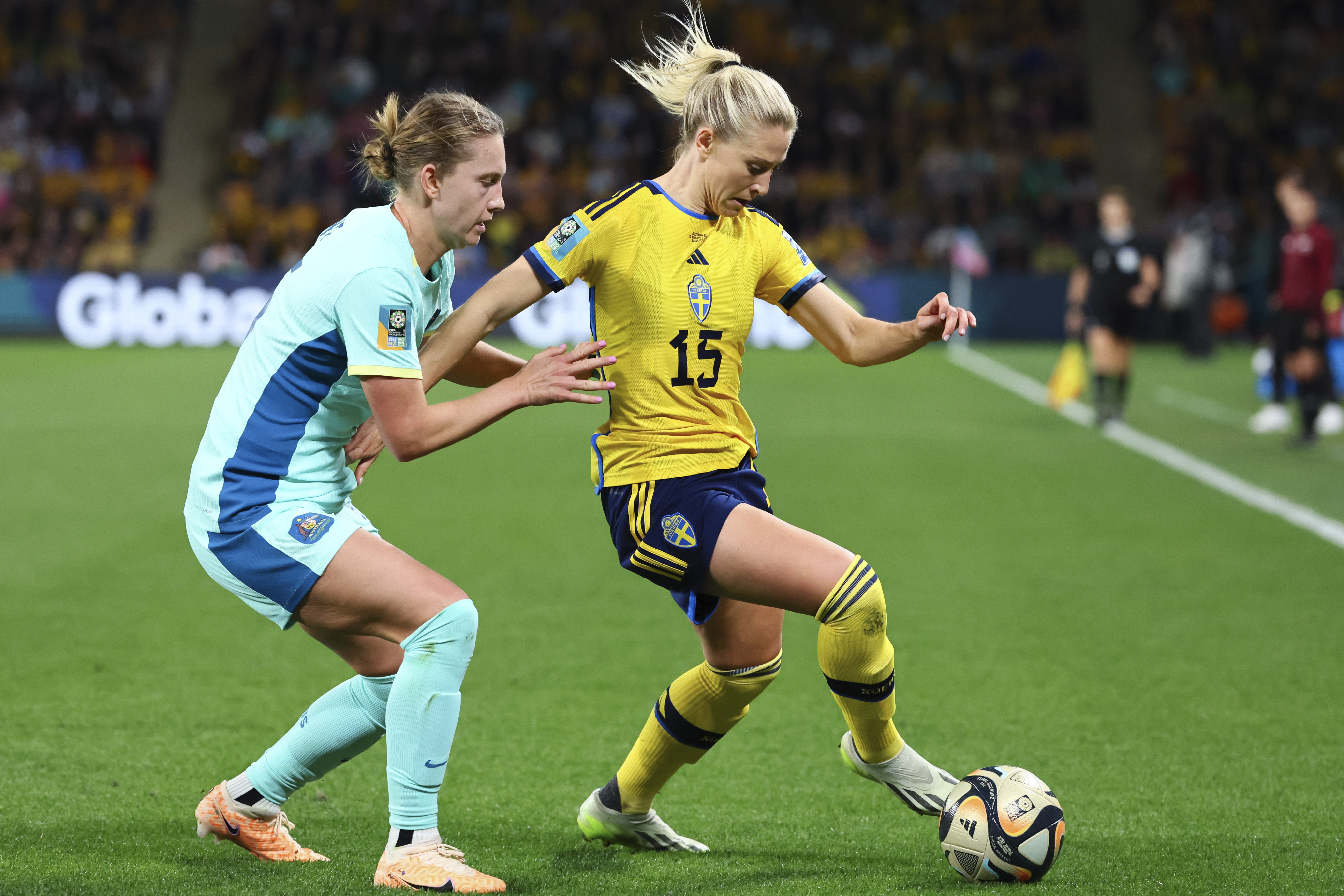 Sweden's Rebecka Blomqvist, right, and Australia's Clare Hunt compete for the ball during the Women's World Cup third place playoff soccer match between Australia and Sweden in Brisbane, Australia, Saturday, Aug. 19, 2023. (AP Photo/Tertius Pickard)