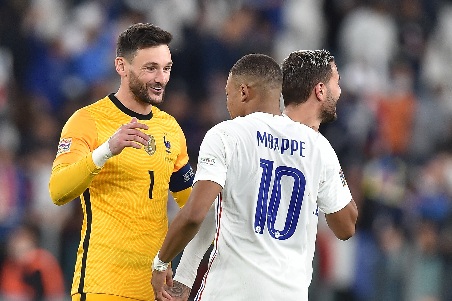 epa09512112 Goalkeeper Hugo Lloris and (L) Kylian Mbappe of France celebrate after winning the UEFA Nations League semi final soccer match between Belgium and France in Turin, Italy, 07 October 2021.  EPA-EFE/Alessandro di Marco