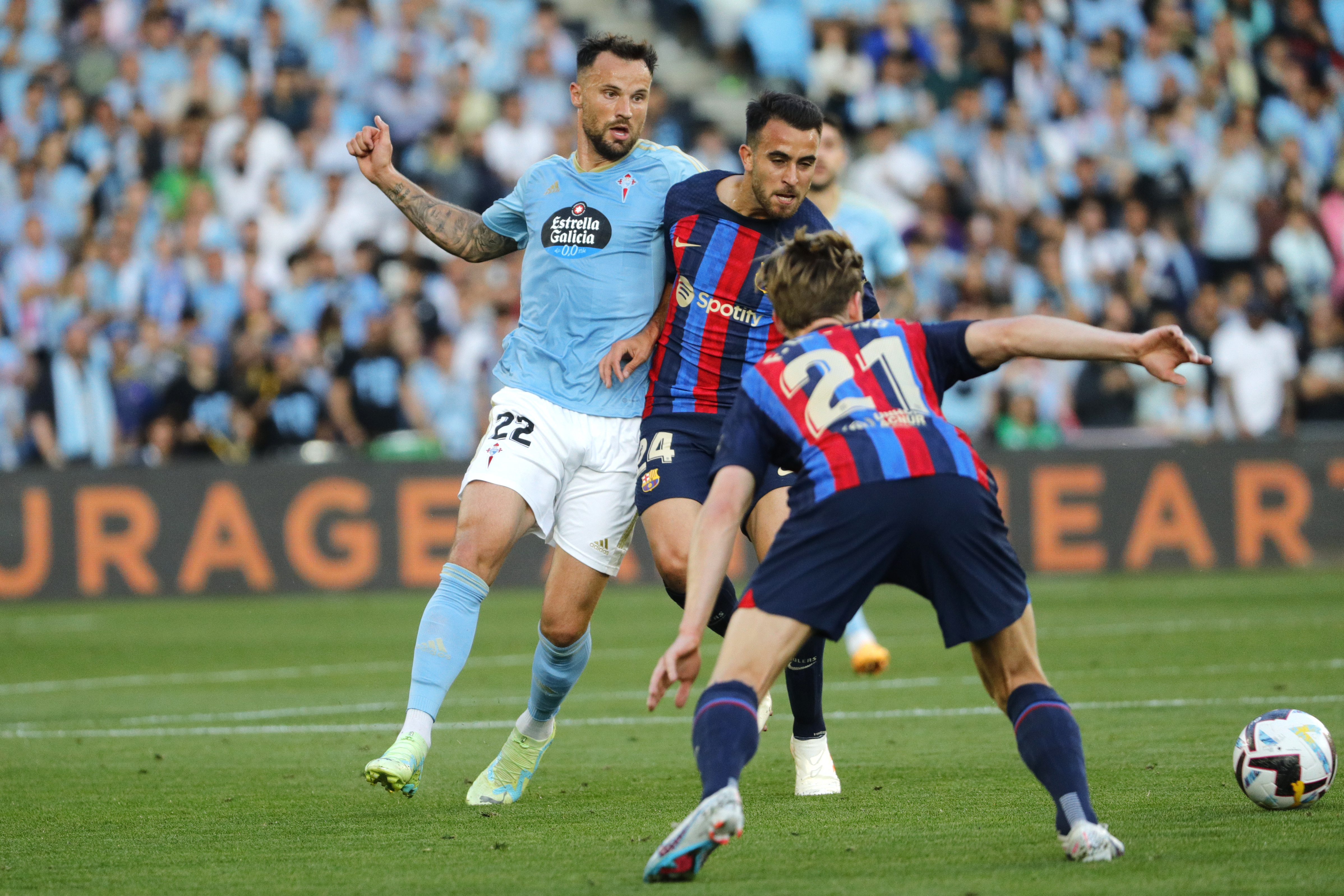 Celta Vigo's Haris Seferovic, left, challenges for the ball with Barcelona's Eric Garcia during the Spanish La Liga soccer match between Celta Vigo and Barcelona at the Balaidos stadium in Vigo, Spain, Sunday, June 4, 2023. (AP Photo/Lalo R. Villar)