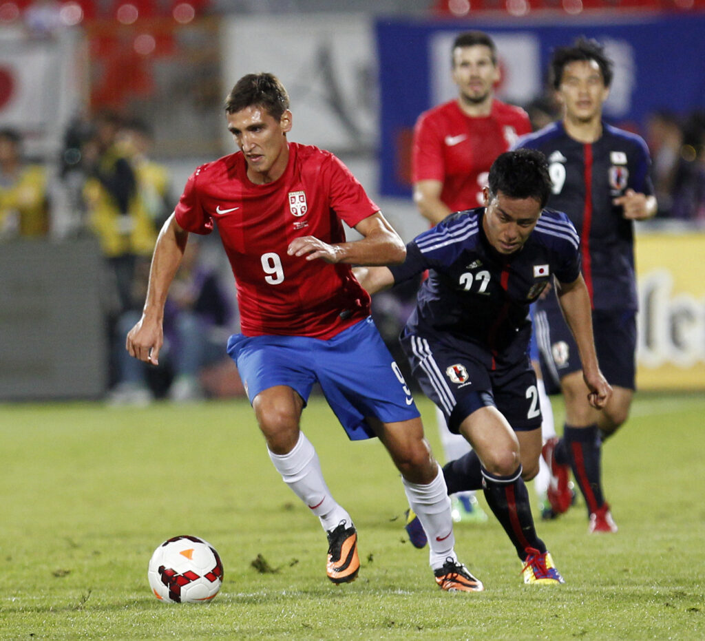 Serbia`s Stefan Scepovic (L) in action during international friendly football game between Serbia and Japan, at Karadjordje stadium in Novi Sad, Serbia, Friday, Oct. 11, 2013. (credit: Pedja Milosavljevic  / thepedja@gmail.com / +381641260959)