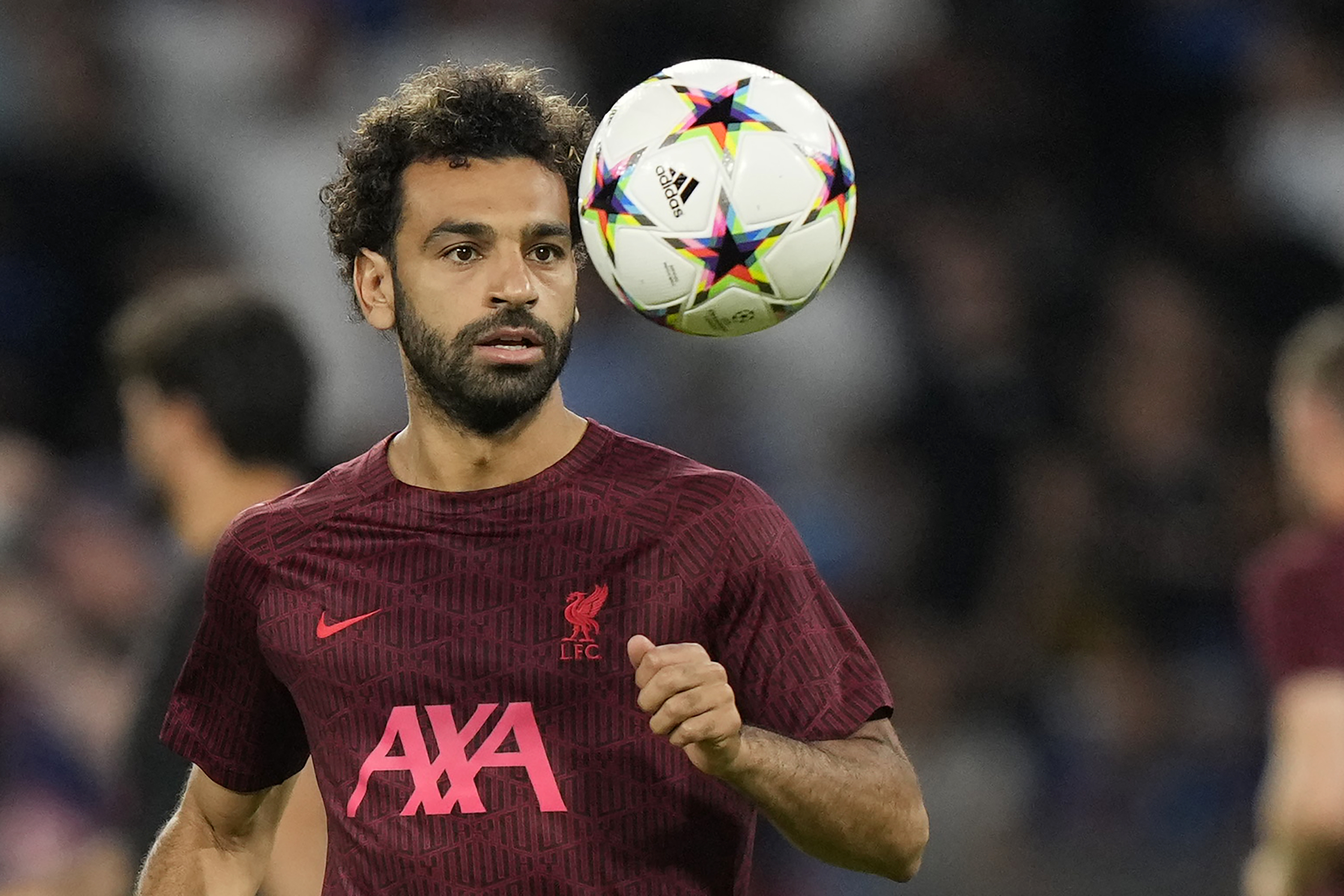 Liverpool's Mohamed Salah warms up before the group A Champions League soccer match between Napoli and Liverpool at the Diego Armando Maradona stadium in Naples, Italy, Wednesday, Sept. 7, 2022. (AP Photo/Andrew Medichini)