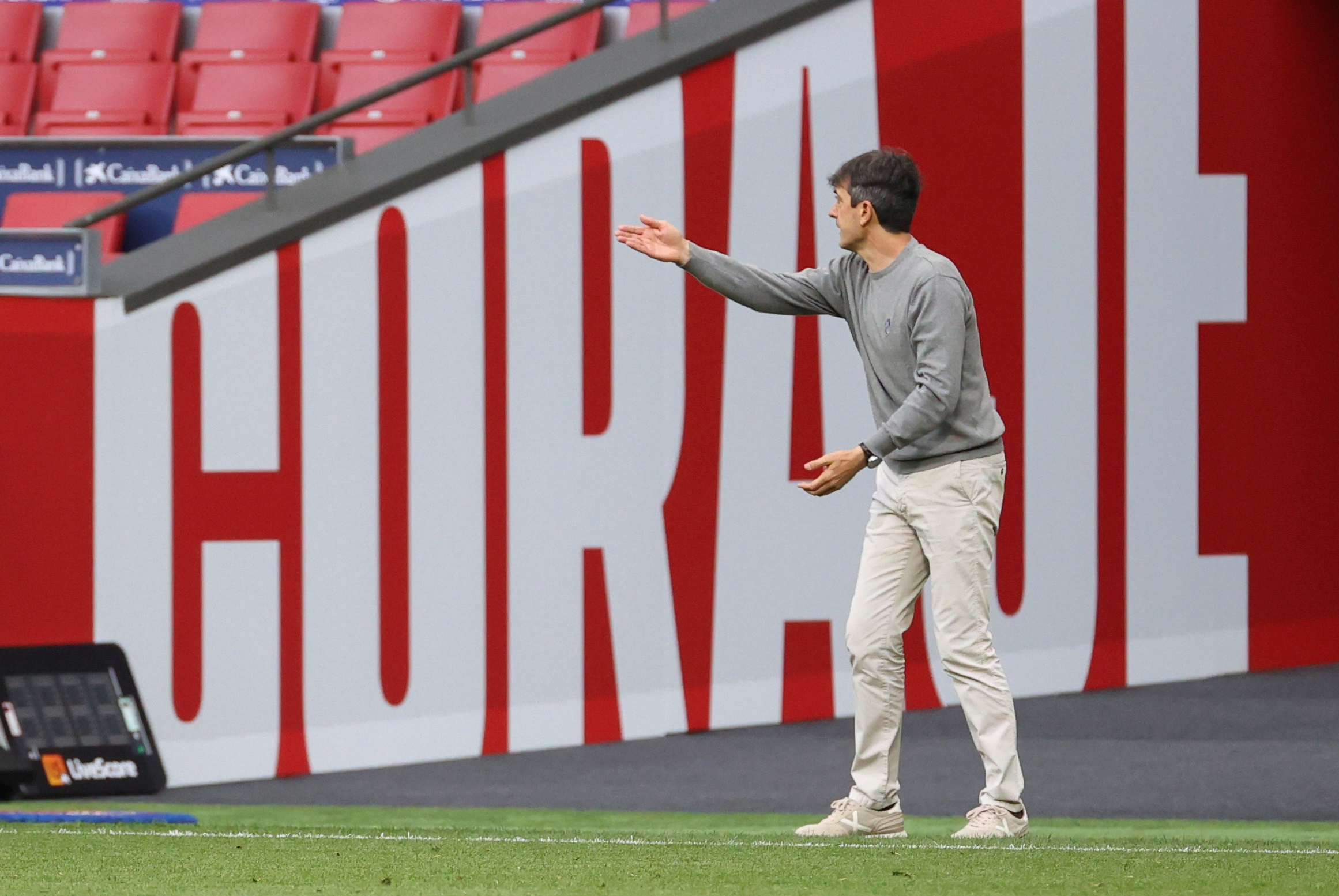 epa09153242 Huesca's head coach Juan Jose Rojo 'Pacheta' reacts during the Spanish LaLiga soccer match between Atletico de Madrid and SD Huesca at Wanda Metropolitano stadium in Madrid, Spain, 22 April 2021.  EPA-EFE/JUANJO MARTIN
