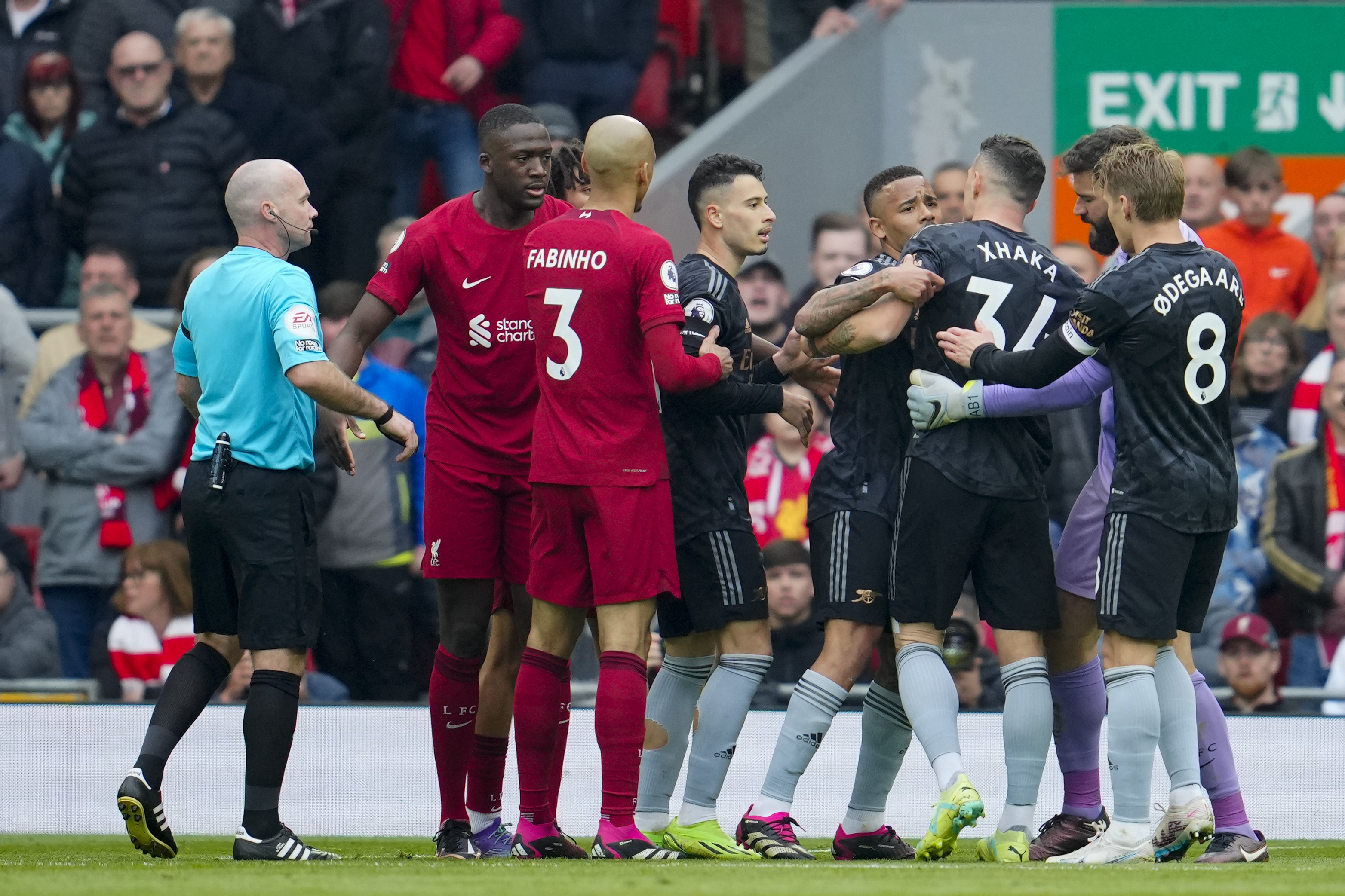 Arsenal's Granit Xhaka argues with Liverpool's Trent Alexander-Arnold during the English Premier League soccer match between Liverpool and Arsenal at Anfield in Liverpool, England, Sunday, April 9, 2023. (AP Photo/Jon Super)