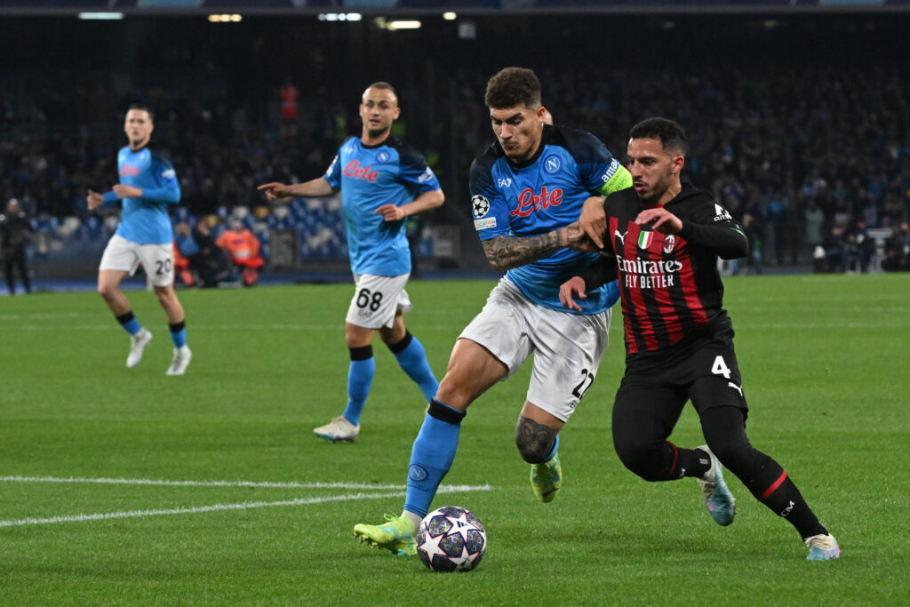 epa10579047 Napoli's defender Giovanni Di Lorenzo (L) and Milans midfielder Ismael Bennacer in action during the UEFA Champions League quarter final second leg soccer match SSC Napoli vs AC Milan in Naples, Italy, 18 April 2023.  EPA-EFE/CIRO FUSCO
