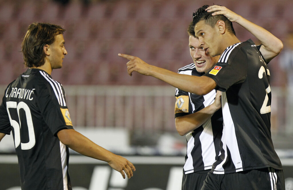 Fudbal season 2012-2013 Jelen Super league.Partizan v BSK Borca.Mohamed Zabiaa Zabya celebrate with Nikola Ninkovic and Lazar Markovic.Beograd, 11.08.2012..foto: Srdjan Stevanovic/Starsportphoto ©