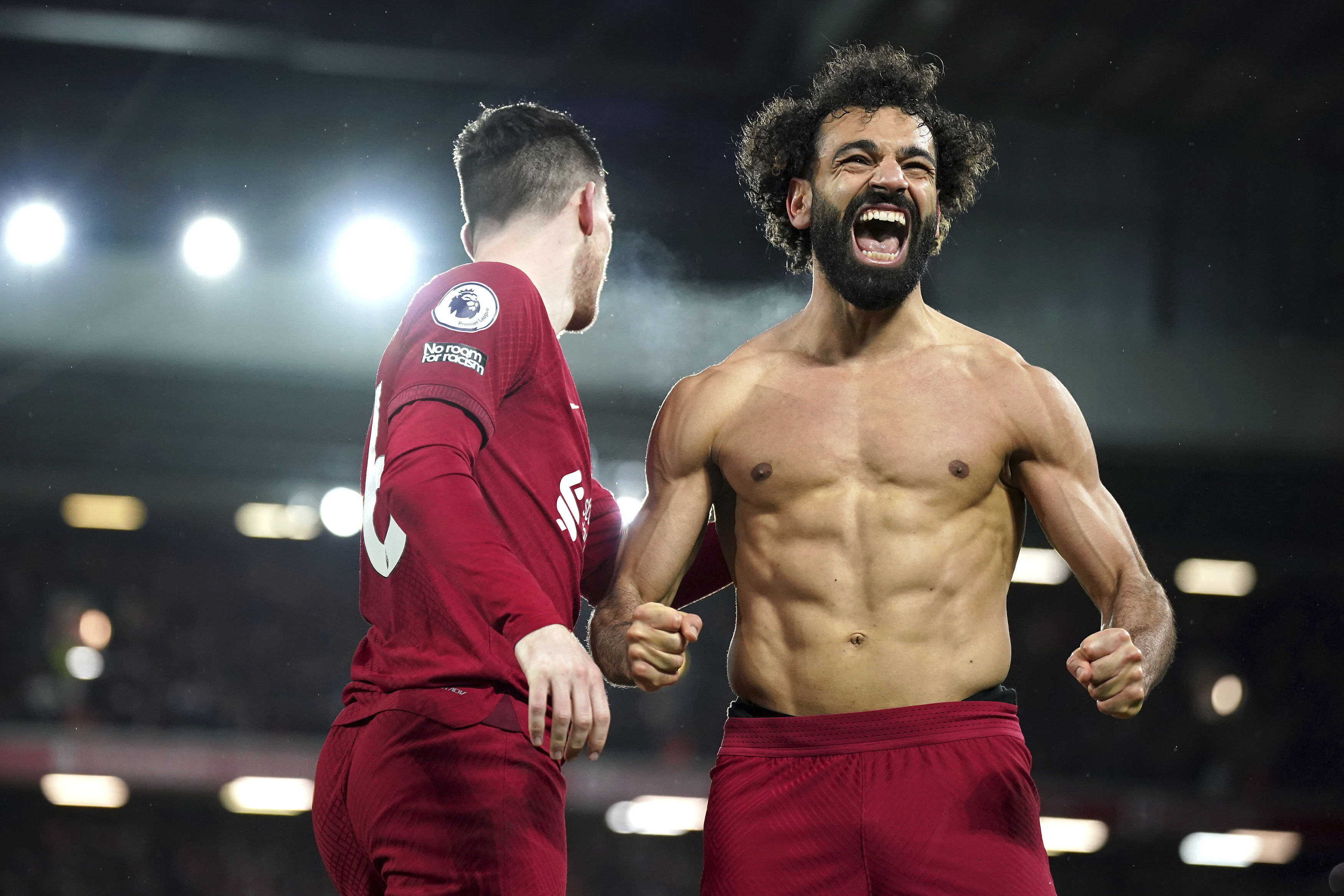 Liverpool's Mohamed Salah celebrates after scoring his side's sixth goal during the English Premier League soccer match between Liverpool and Manchester United at Anfield in Liverpool, England, Sunday, March 5, 2023. (Peter Byrne/PA via AP)