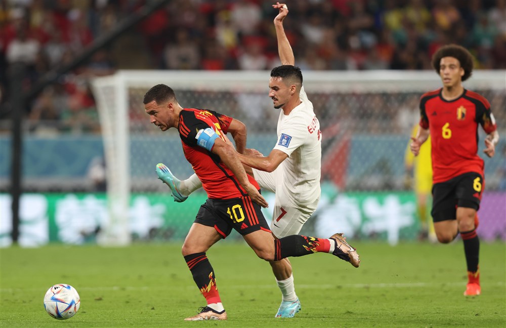 epa10323606 Eden Hazard (L) of Belgium in action against Stephen Eustaquio of Canada during the FIFA World Cup 2022 group F soccer match between Belgium and Canada at Ahmad bin Ali Stadium in Doha, Qatar, 23 November 2022.  EPA-EFE/Tolga Bozoglu