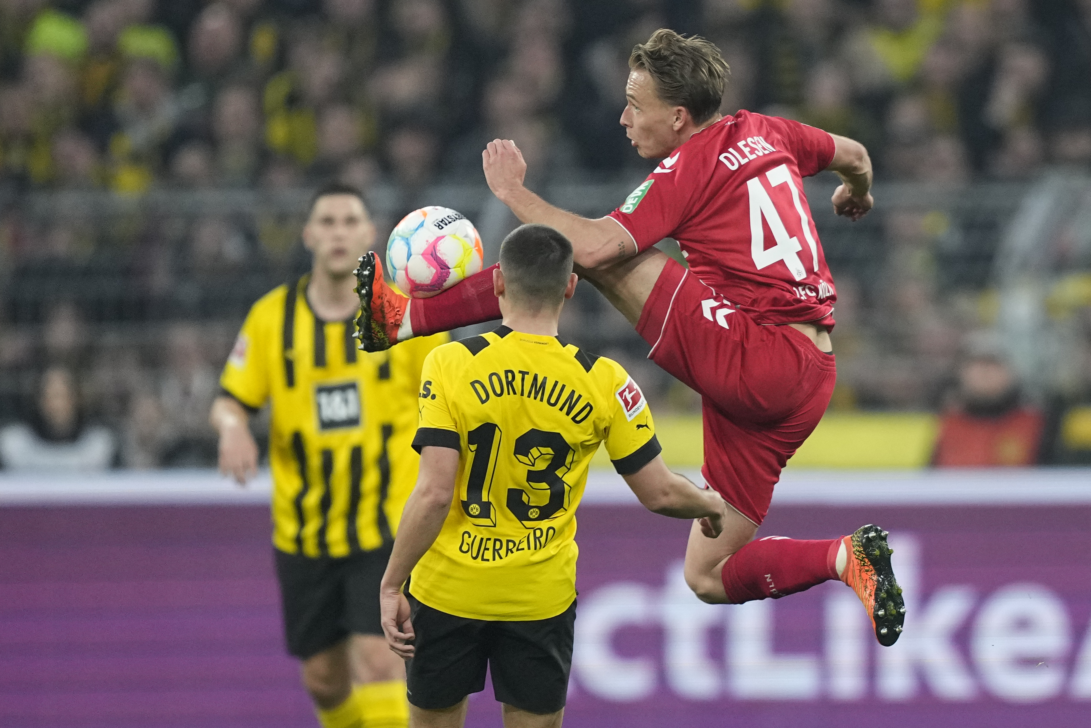 Cologne's Mathias Olesen is in action during the German Bundesliga soccer match between Borussia Dortmund and 1.FC Cologne in Dortmund, Germany, Saturday, March 18, 2023. (AP Photo/Martin Meissner)