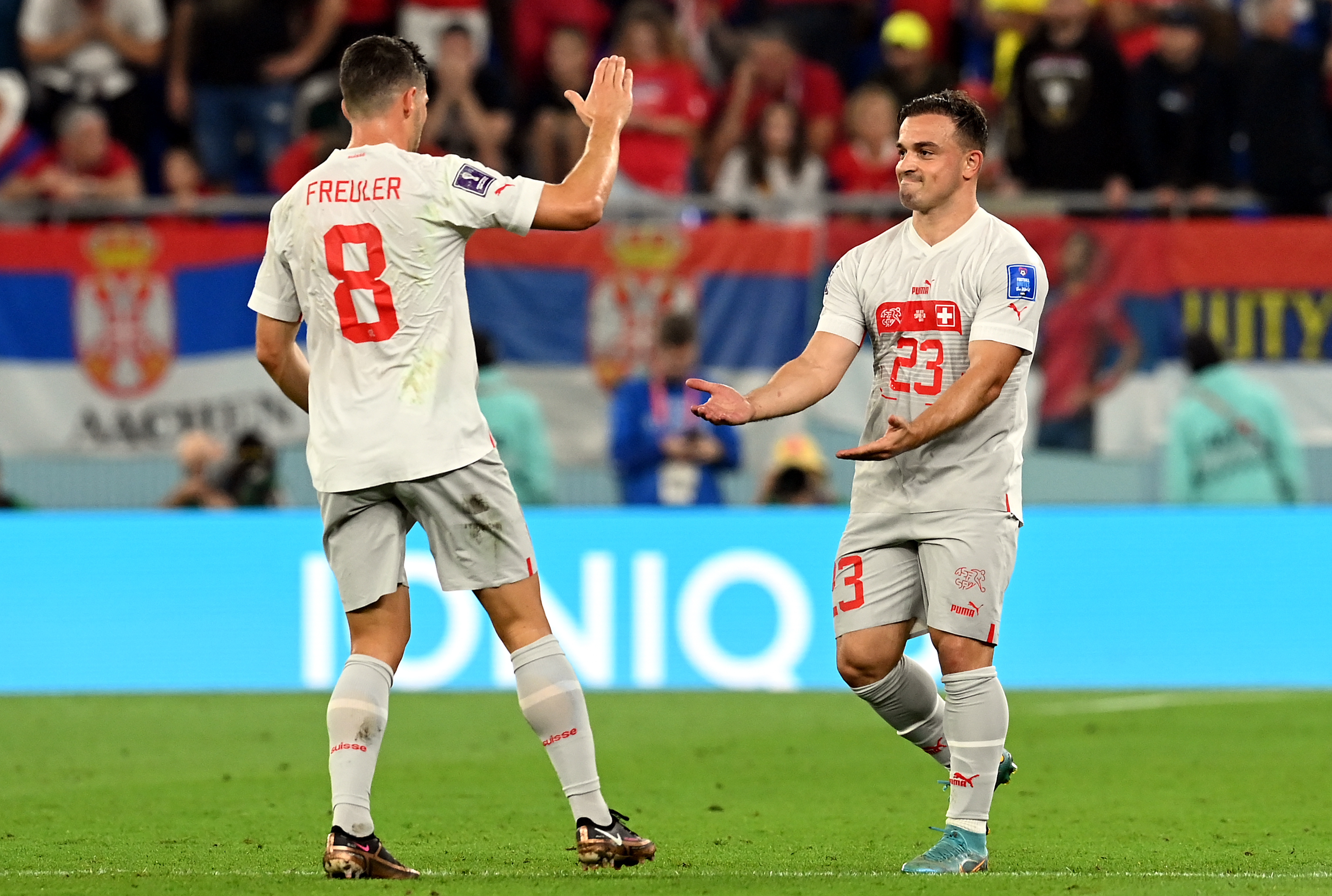 epa10345108 Xherdan Shaqiri of Switzerland (R) celebrates after scoring the 1-0 with Remo Freuler  during the FIFA World Cup 2022 group G soccer match between Serbia and Switzerland at Stadium 947 in Doha, Qatar, 02 December 2022.  EPA-EFE/Georgi Licovski