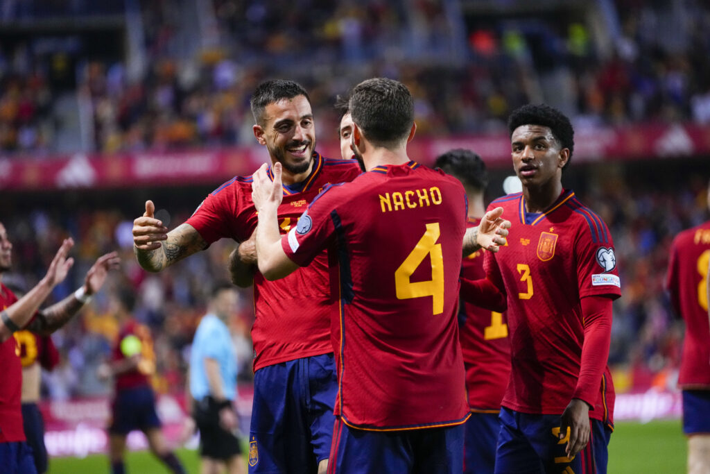 Spain's Joselu, left, is congratulated after scoring his side's 2nd goal during the Euro 2024 group A qualifying soccer match between Spain and Norway at La Rosaleda stadium in Malaga, Spain, Saturday, March 25, 2023. (AP Photo/Manu Fernandez)