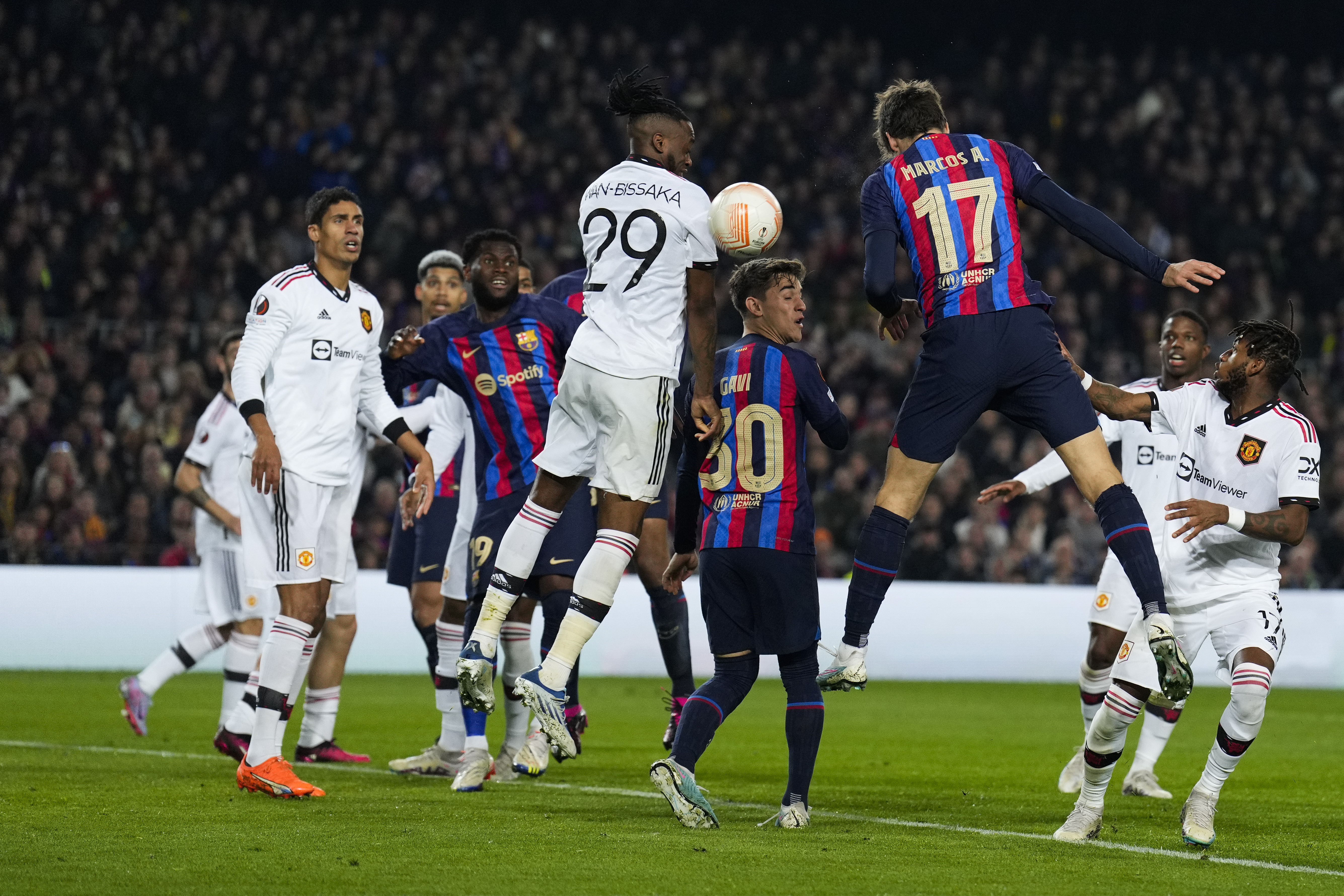 epa10471415 FC Barcelona's defender Marcos Alonso (R) scores the 1-0 goal during the Europa League playoff, first leg soccer match between FC Barcelona and Manchester United, in Barcelona, Spain, 16 February 2023.  EPA-EFE/Alejandro Garcia