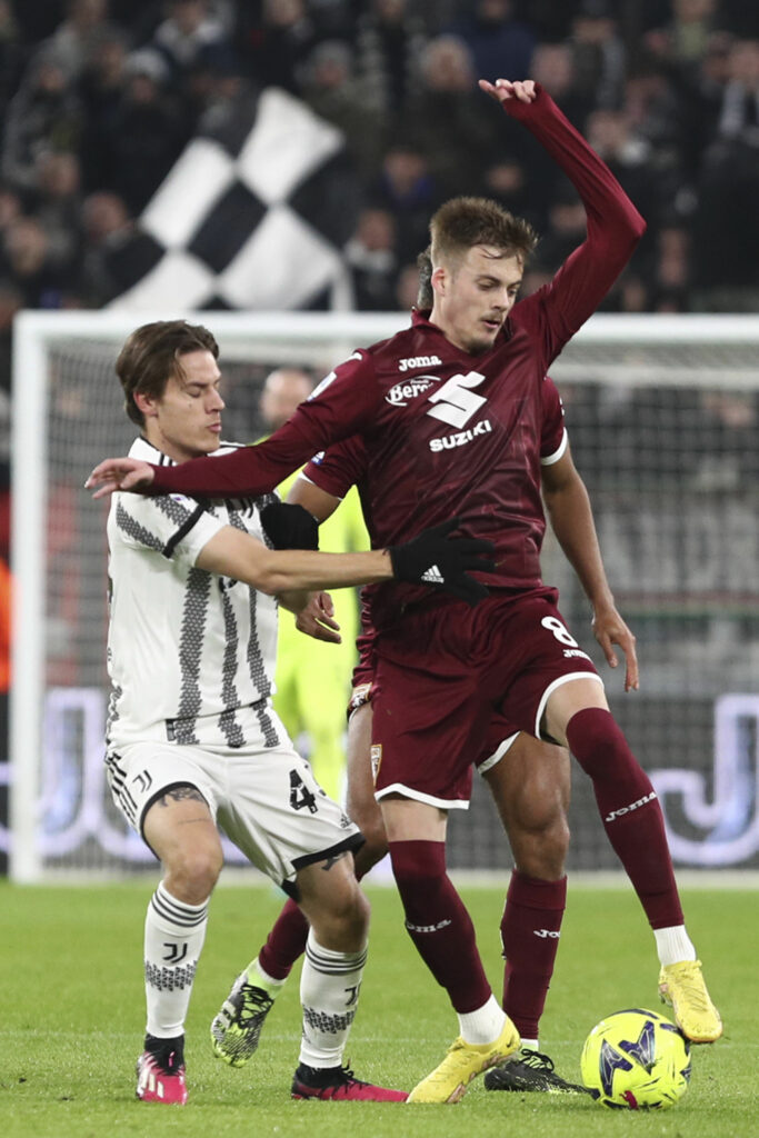 Torino's Ivan Ilic, right, and Juventus' Nicolo Fagioli in action during the Serie A soccer match between Juventus and Torino at Juventus Stadium, Turin, Italy, Tuesday Feb. 28, 2023. (Fabio Ferrari/LaPresse via AP)
