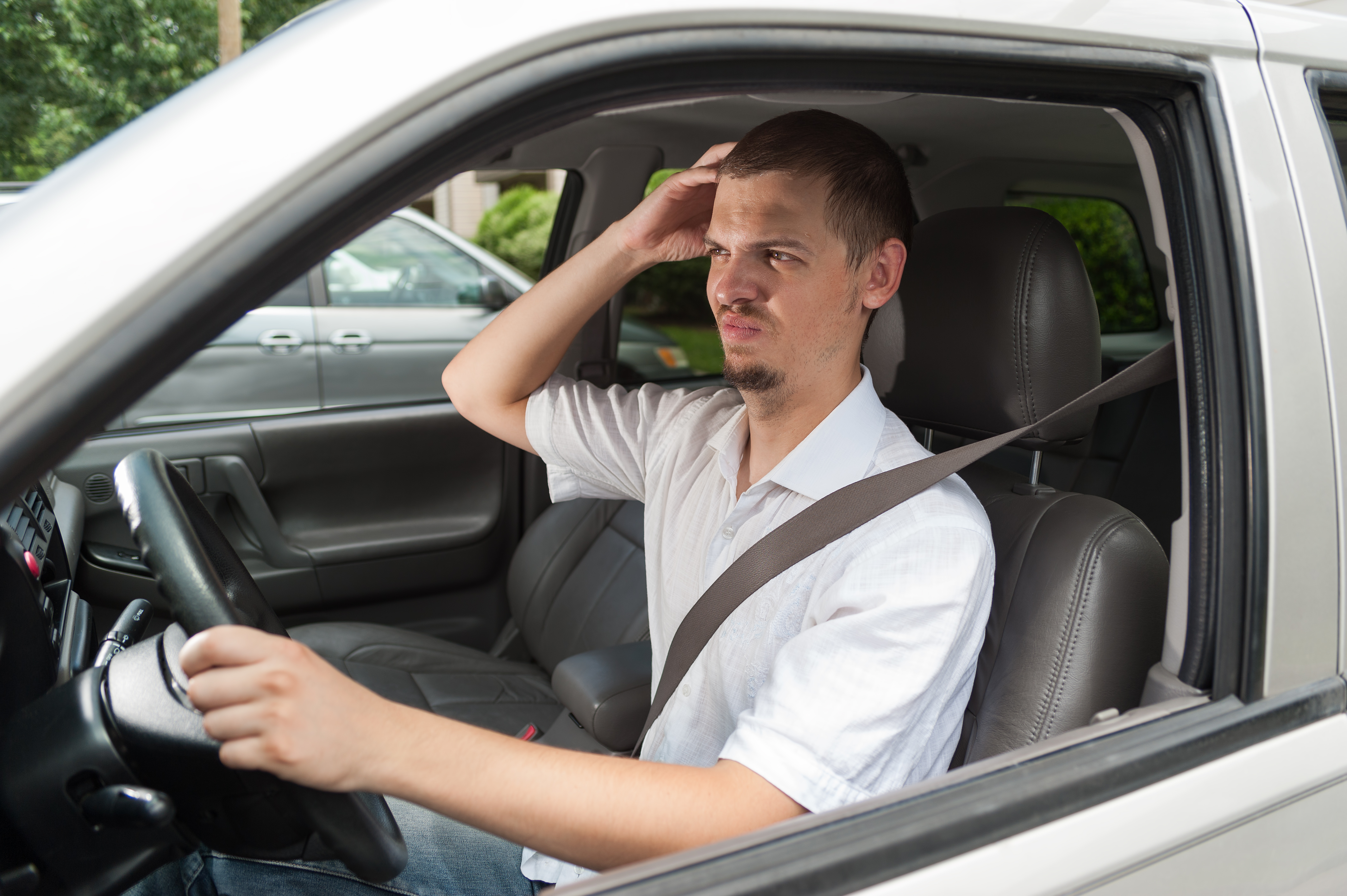 Young,Caucasian,Driver,Is,Thinking,About,Something