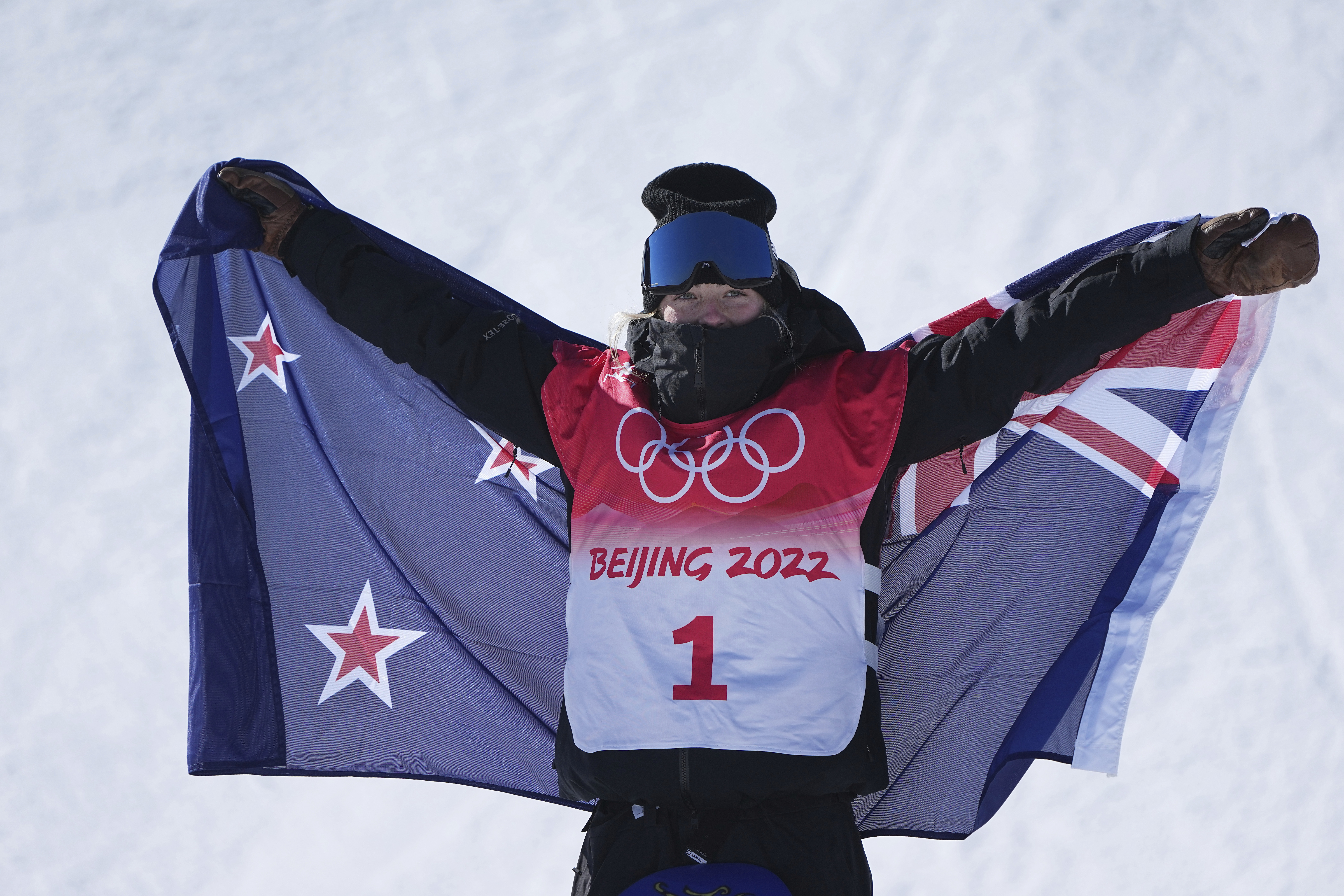 New Zealand's Zoi Sadowski Synnott celebrates after winning a gold medal in the women's slopestyle at the 2022 Winter Olympics, Sunday, Feb. 6, 2022, in Zhangjiakou, China. (AP Photo/Gregory Bull)